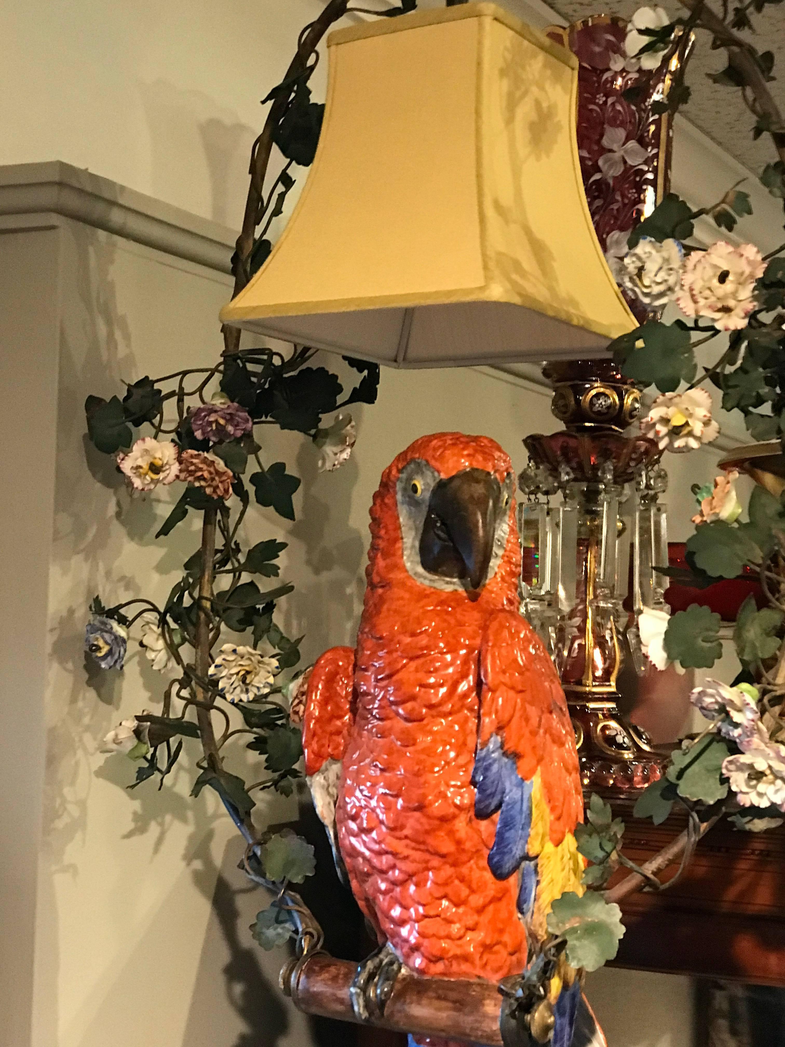 Meissen style parrot chandelier, large beautifully painted and modeled figure of a perched parrot. Sitting in a gilt bronze trellis with porcelain flowers
The parrot alone is 24 inches high.