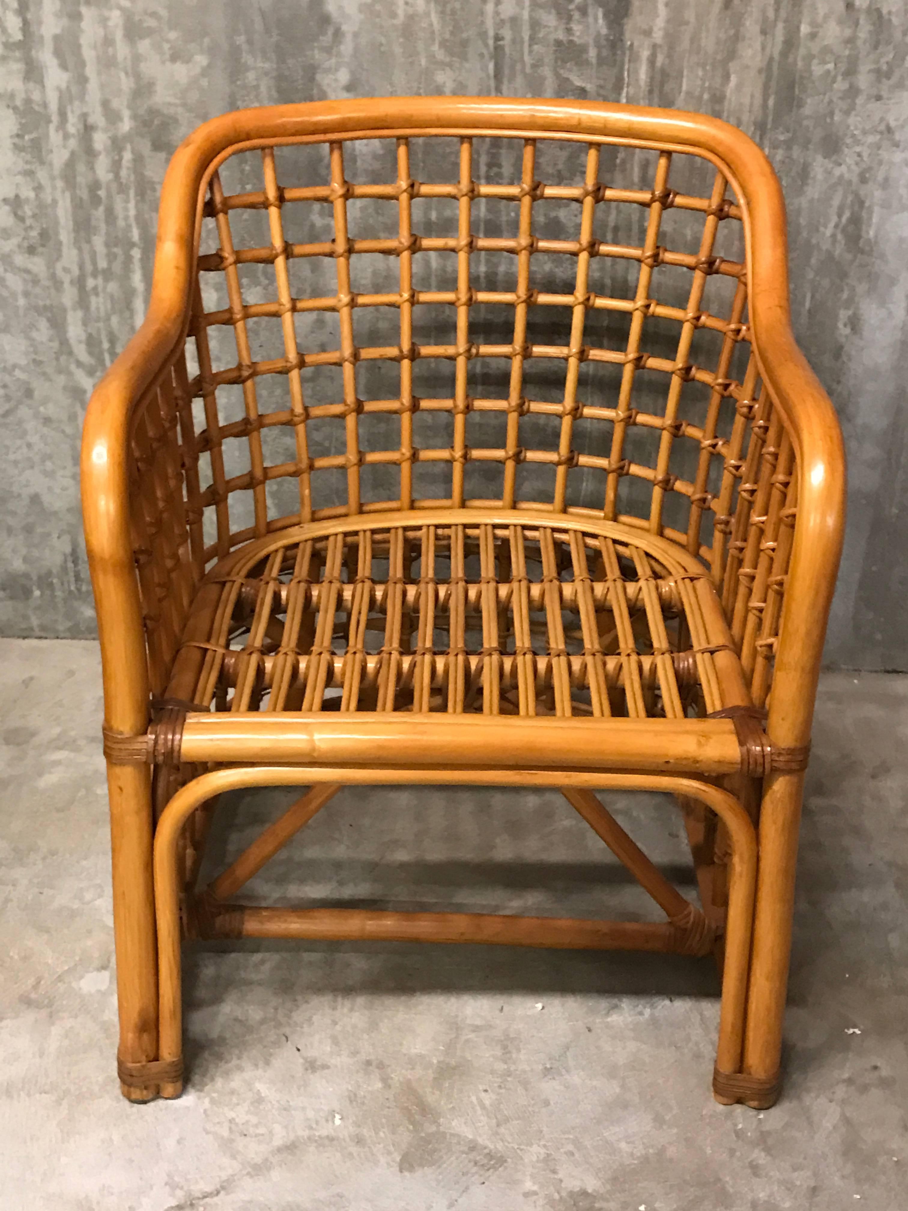 A great pair of sturdy exquisite woven rattan club chairs in the style of Franco Albini. We have a second pair available, please inquire. This item is in our NJ Location, Not Atlanta.