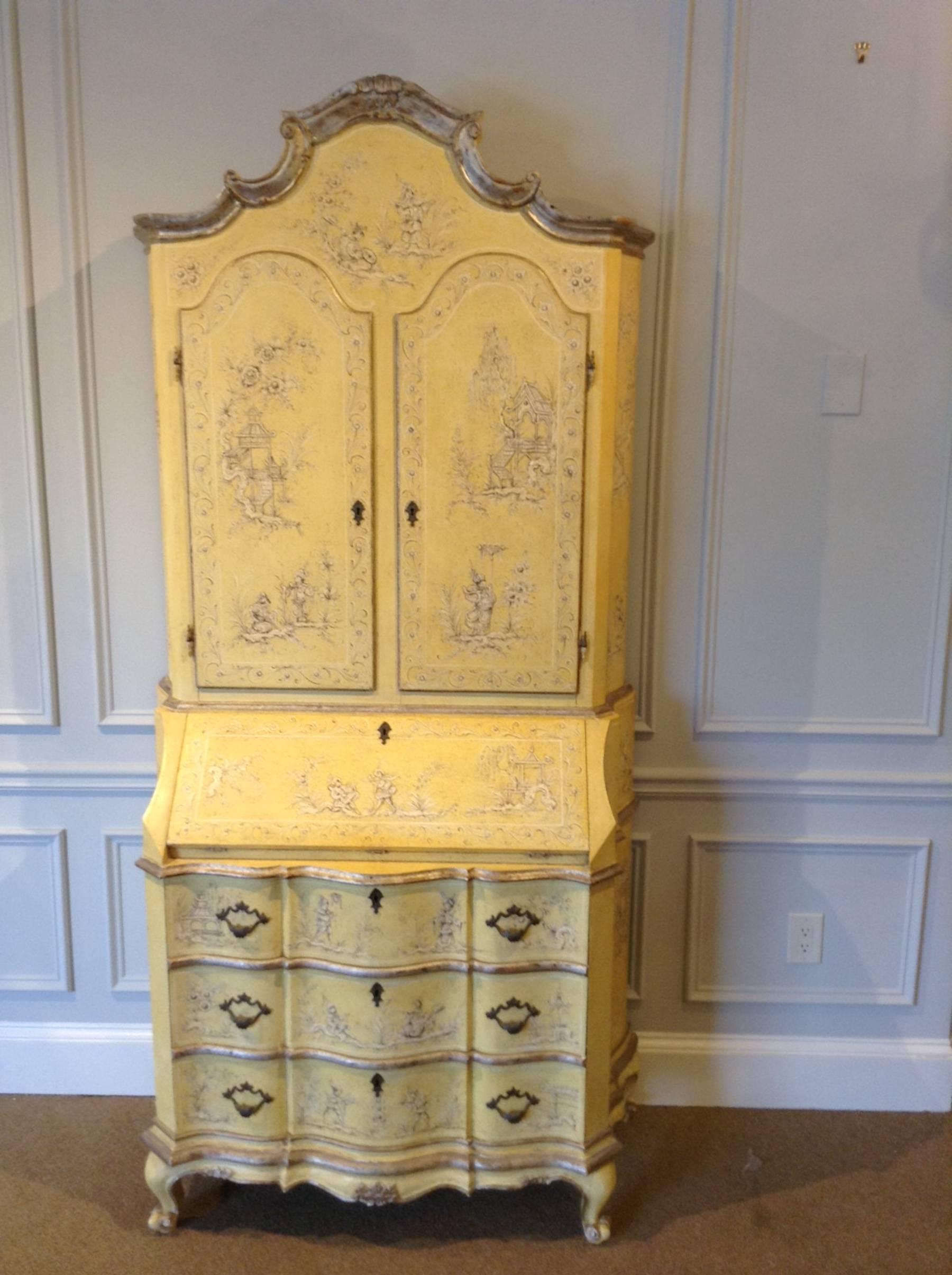 Beautiful Venetian Chinoisere yellow painted secretary, wonderful light yellow with silver leaf and subtle all-over paint decoration. Fitted with two upper blind doors, (33" H x 14" W ) with shelved interior. The lower case with slant