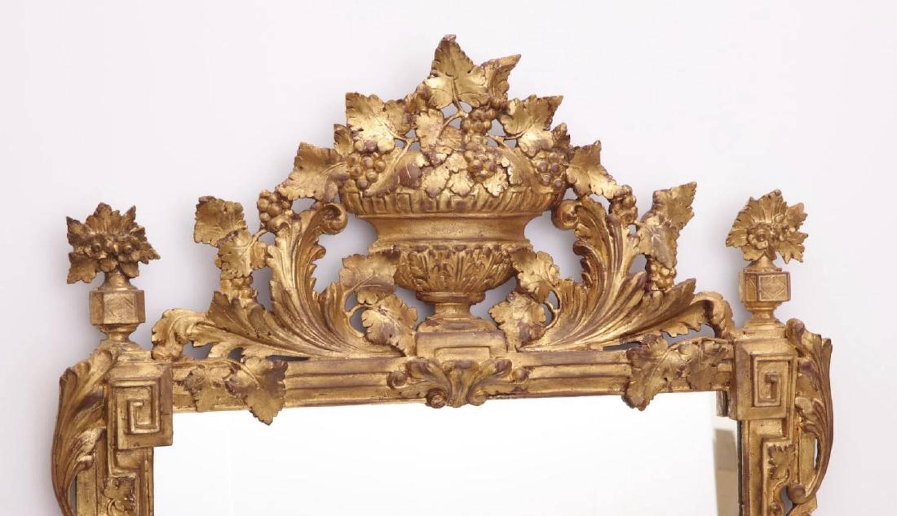 Antique Continental giltwood neoclassic mirror, beautifully carved floret frame with trellis 
Presently this item is located in at our NJ warehouse.