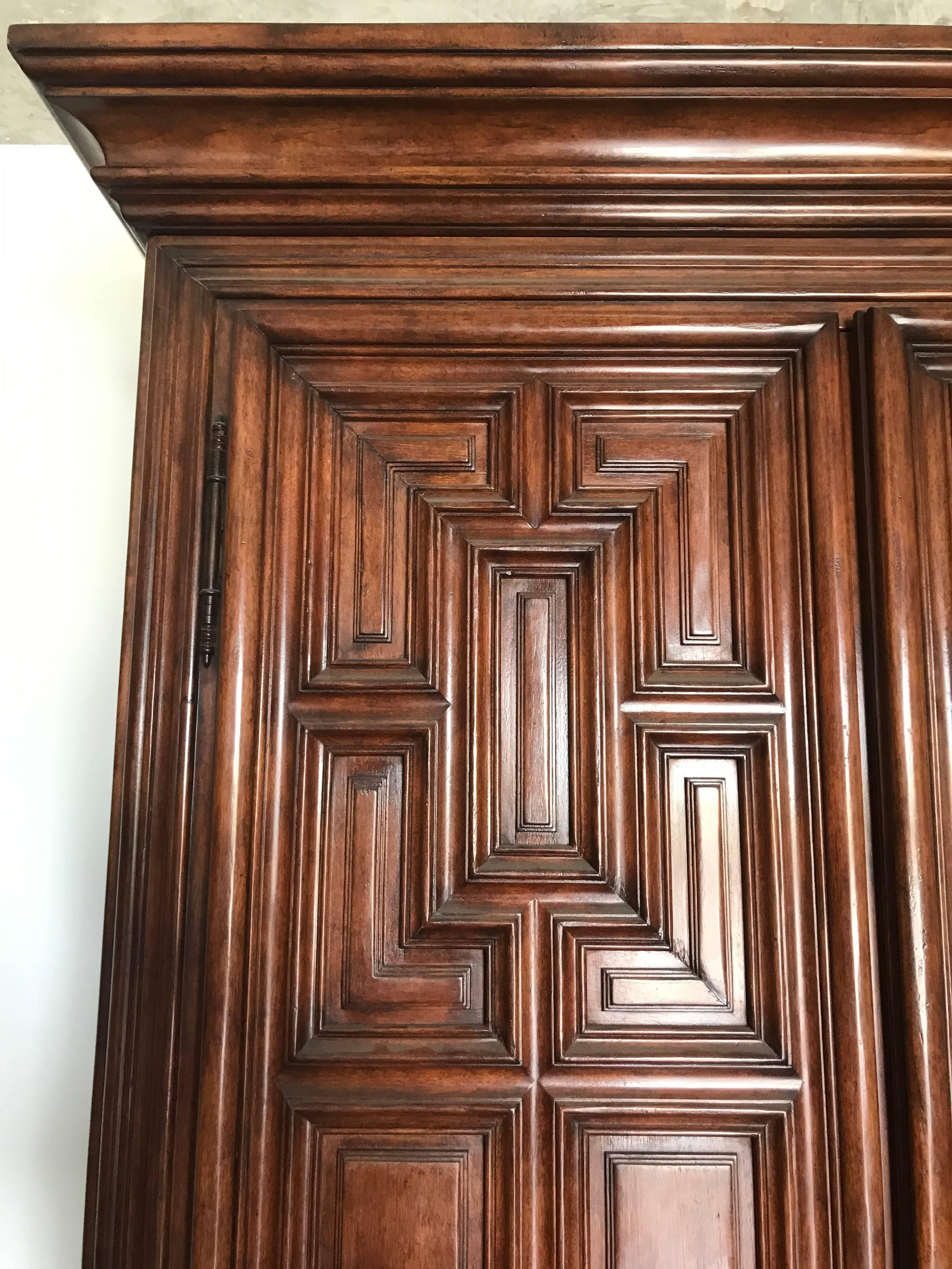 Geometric Armoire Geometric Armoire by Charles Pollock for the William Switzer Collection exquisite floor room sample. Of generous porptions, beautifully carved and finished. This item is not fitted as a TV cabinet, this piece is only fitted with 2