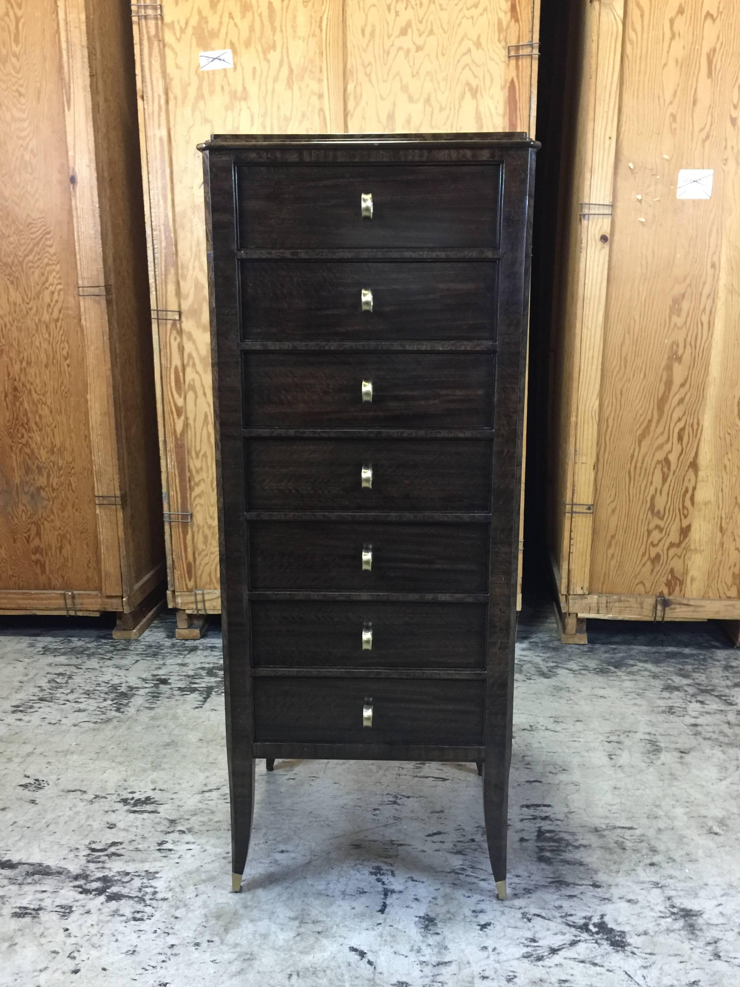 Art Deco ebonized semanier from the Lucien Rollin collection by William Switzer, tall and sleek fitted with seven good size drawers. This item is a floor sample in excellent condition. 
This item is at our Atlanta GA, Location, not Palm