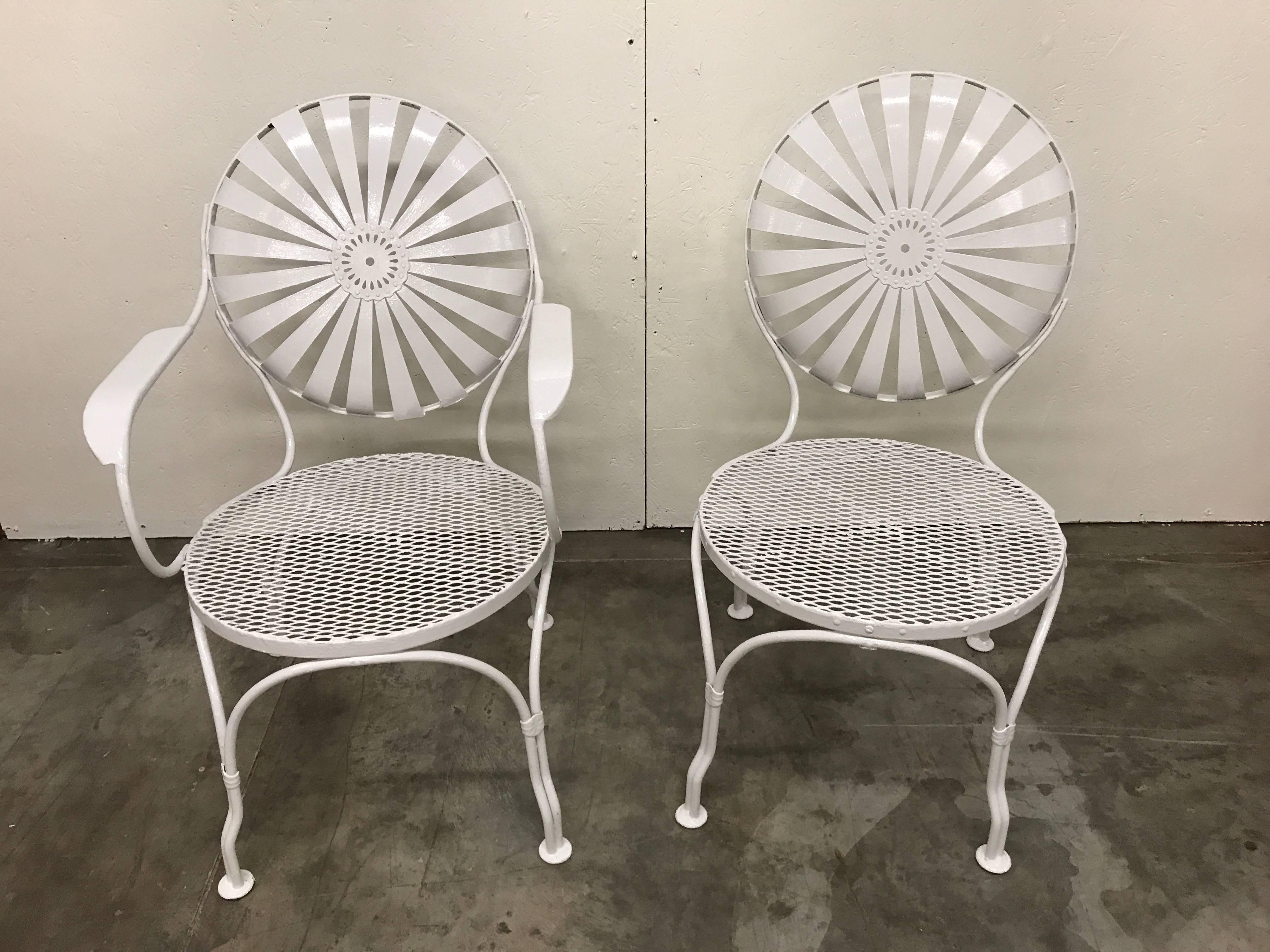 Set of six sunburst back chairs, by Francois Carre, consisting of one armchair and five side chairs with varying seat back measure: heights of 31