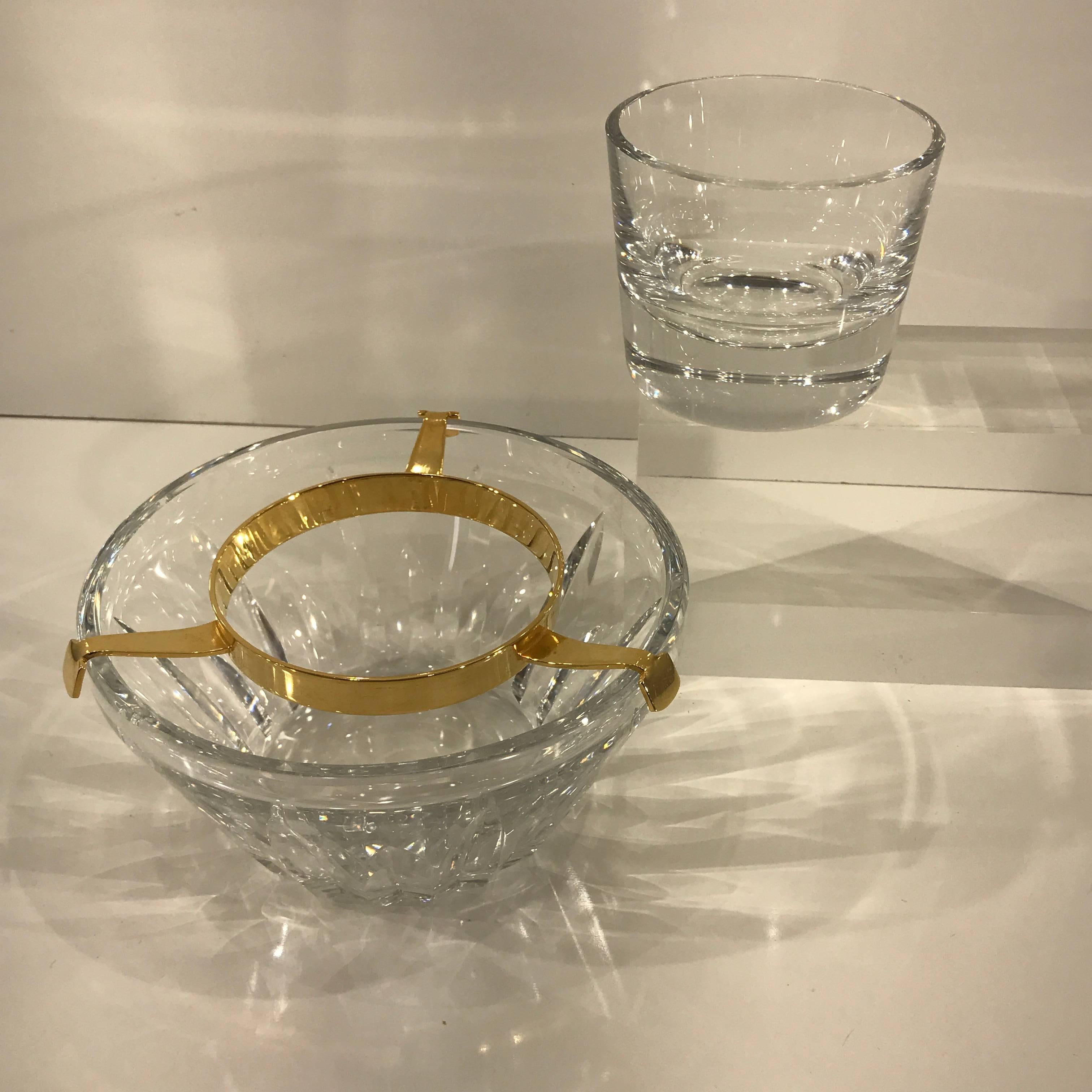 Substantial three-piece circular crystal caviar dish, signed Baccarat, consisting of a deep 3-inch Baccarat crystal centre bowl for the caviar, a three-prong bright and shiny ormolu caddy, that fits within a larger subtle diamond cut 7 1/2 inch