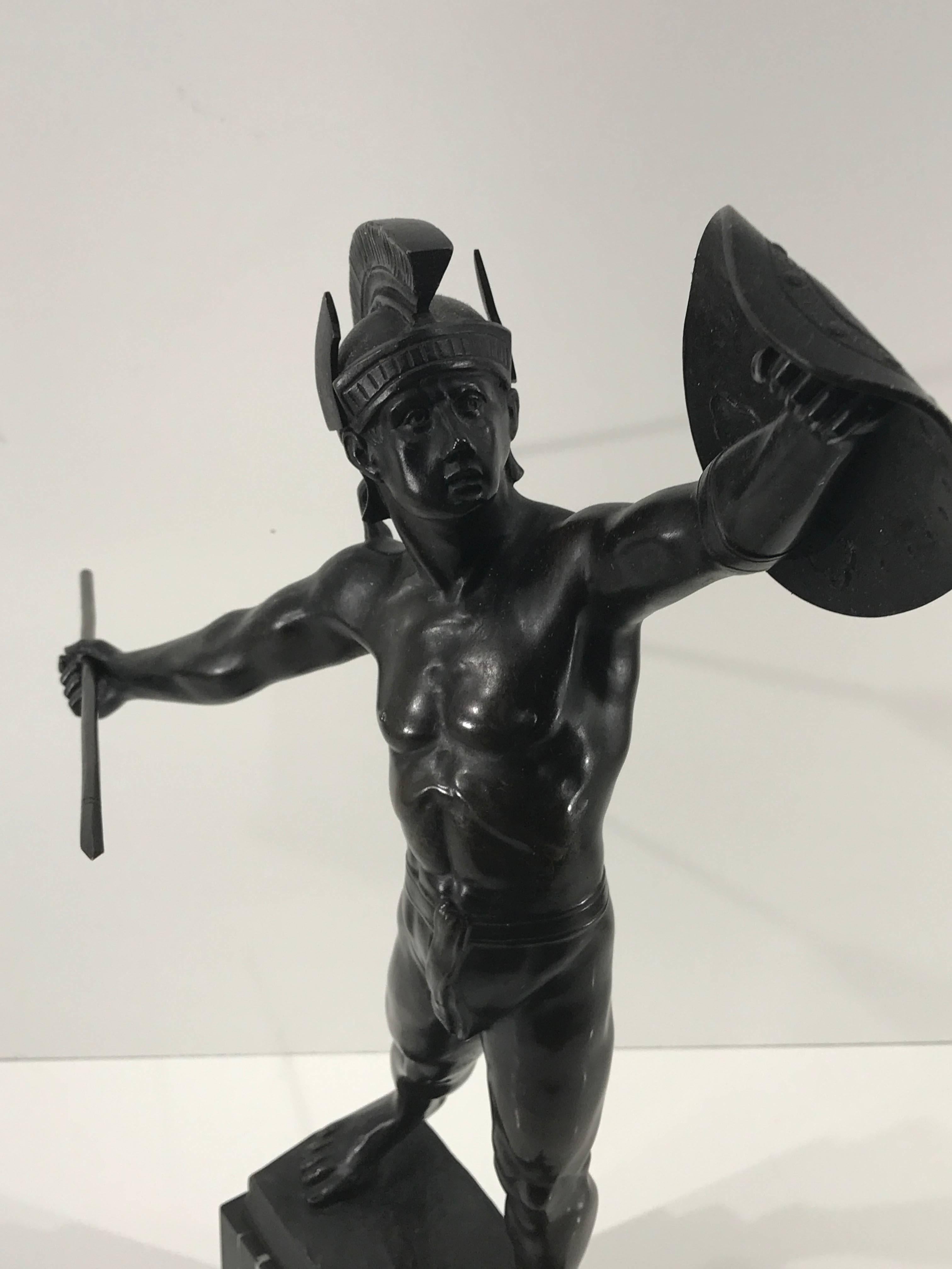 Grand tour bronze sculpture of Ares in Combat by Polish sculptor
F. Zwierzejewski. A fine example of later Grand Tour sculpture, circa 1900. The well modelled and cast olive brown patinated standing figure of a helmeted draped figure of the Greek