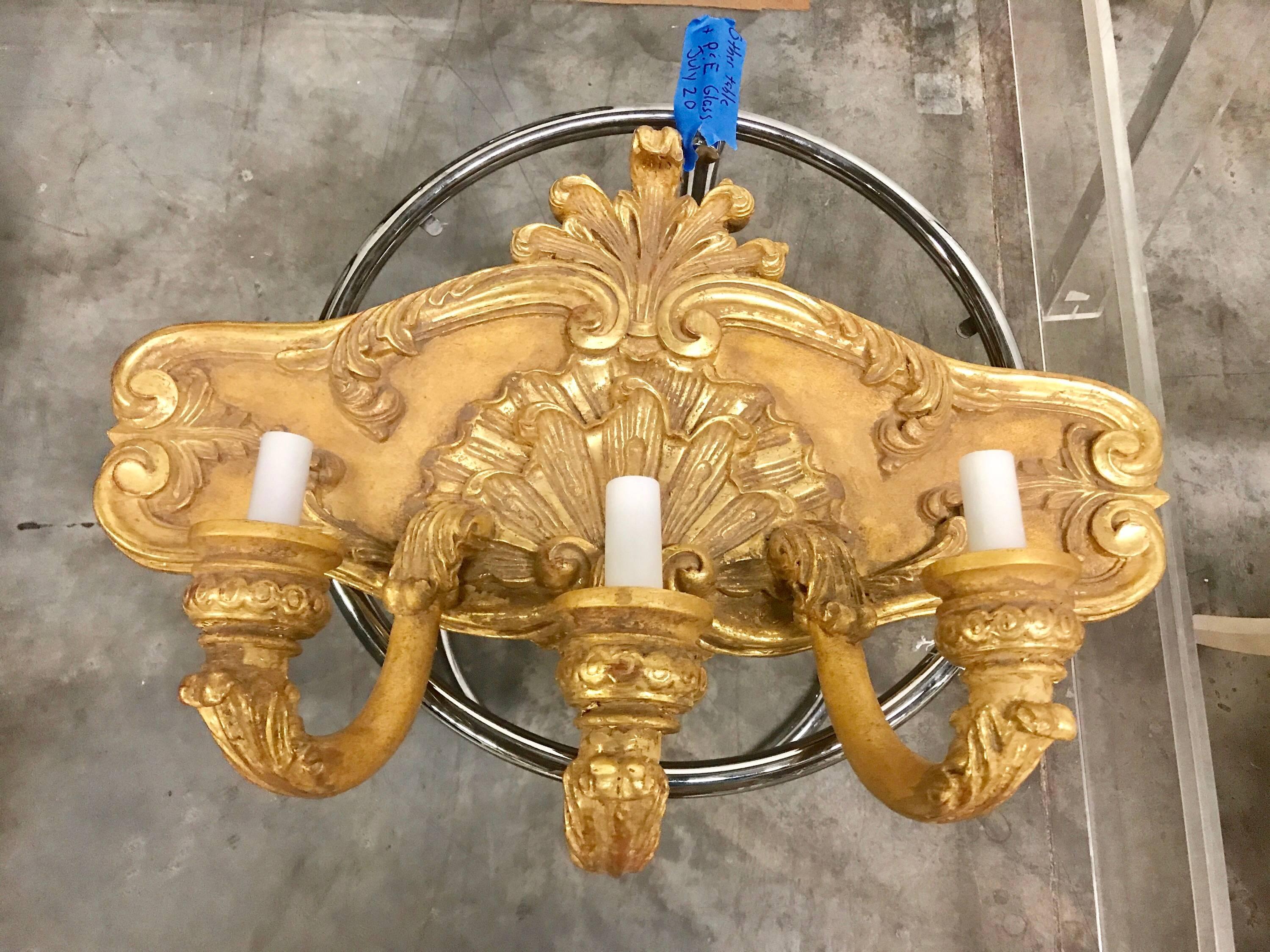 Large pair of French giltwood three-light shell motif wall sconces, electrified
Newly wired.