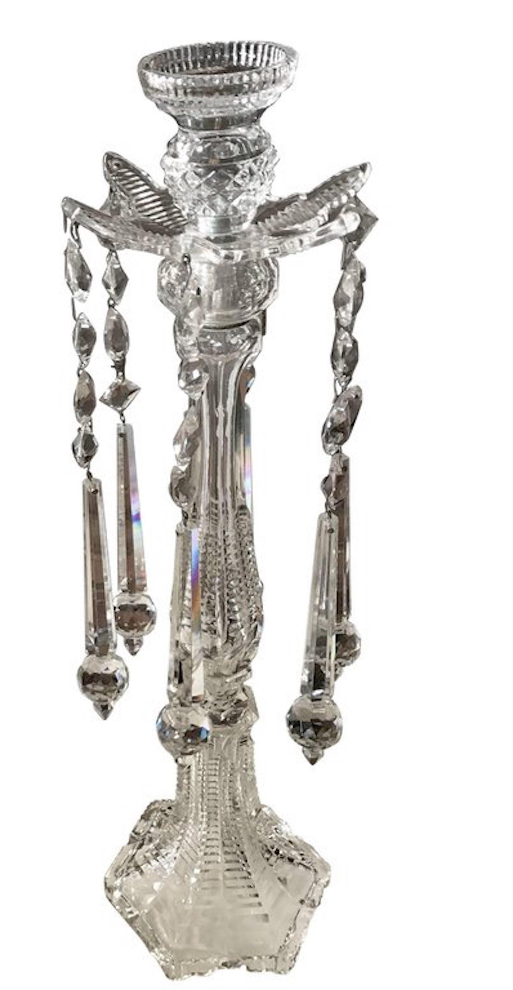 A sumptuous pair of cut crystal tall candlesticks, attributed to F.&C. Osler, each one fitted with 9-inch long prisms, standing 21