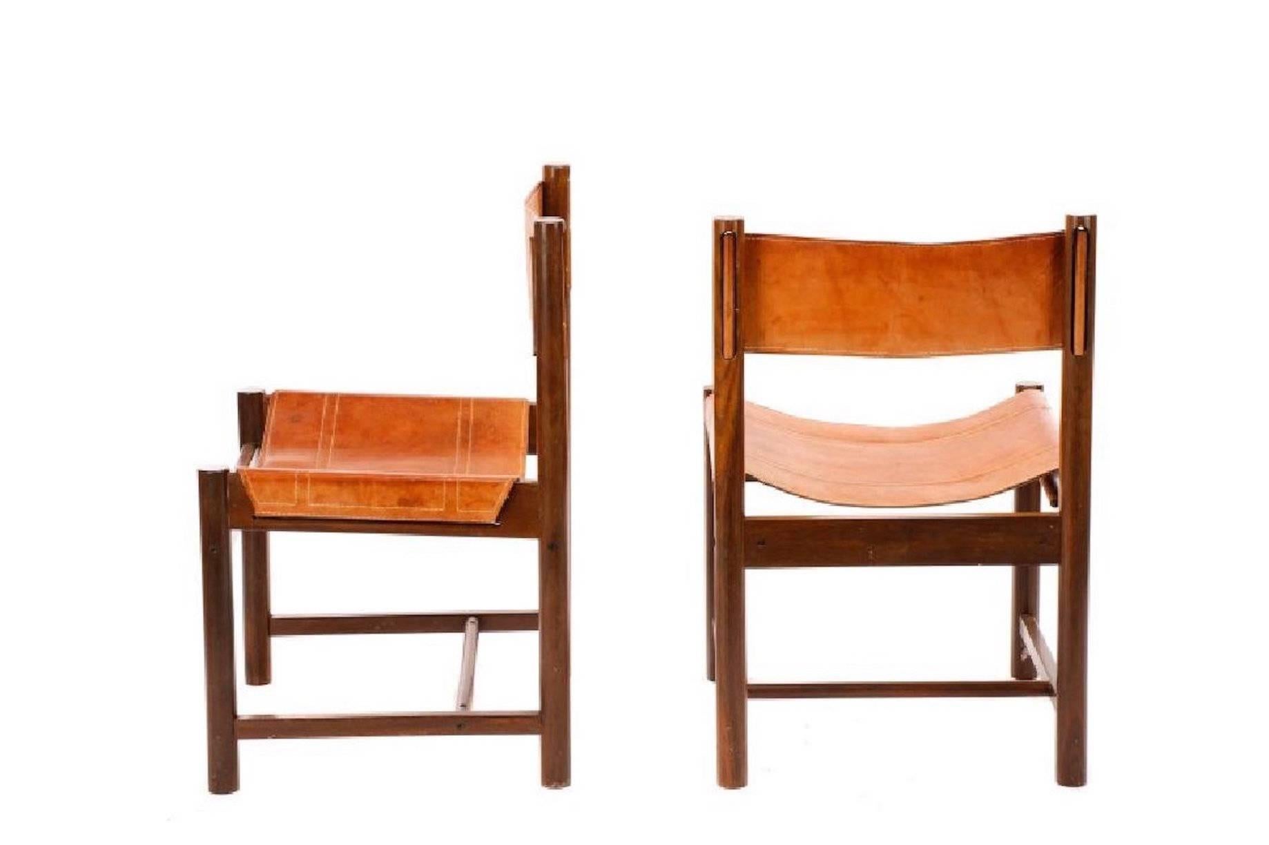 Pair of Michel Arnoult wood and leather chairs.