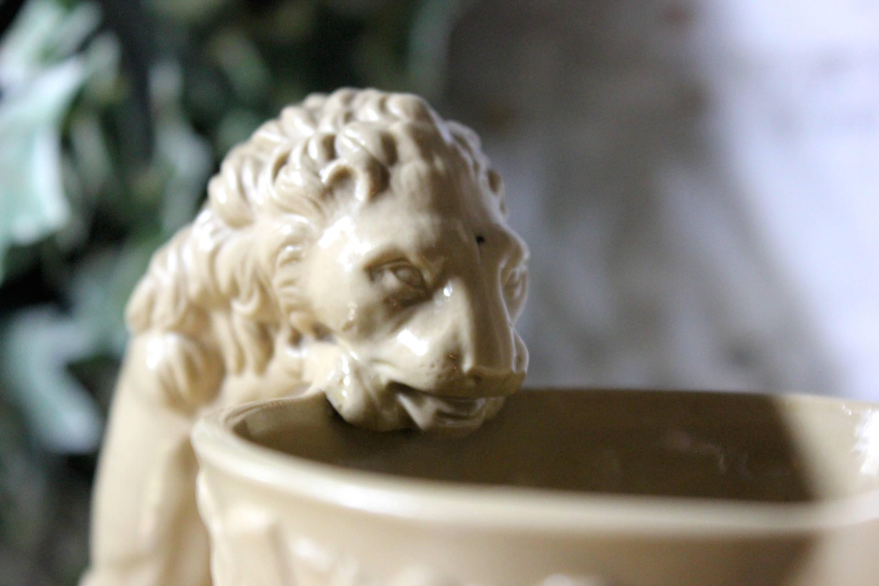 The rare relief moulded buff baluster form jug, in smear-glazed stoneware, made in 1830 to commemorate the death of King George IV, having a bulbous body, short straight neck, pinched spout and over-arching handle, standing on a thin foot-ring, the