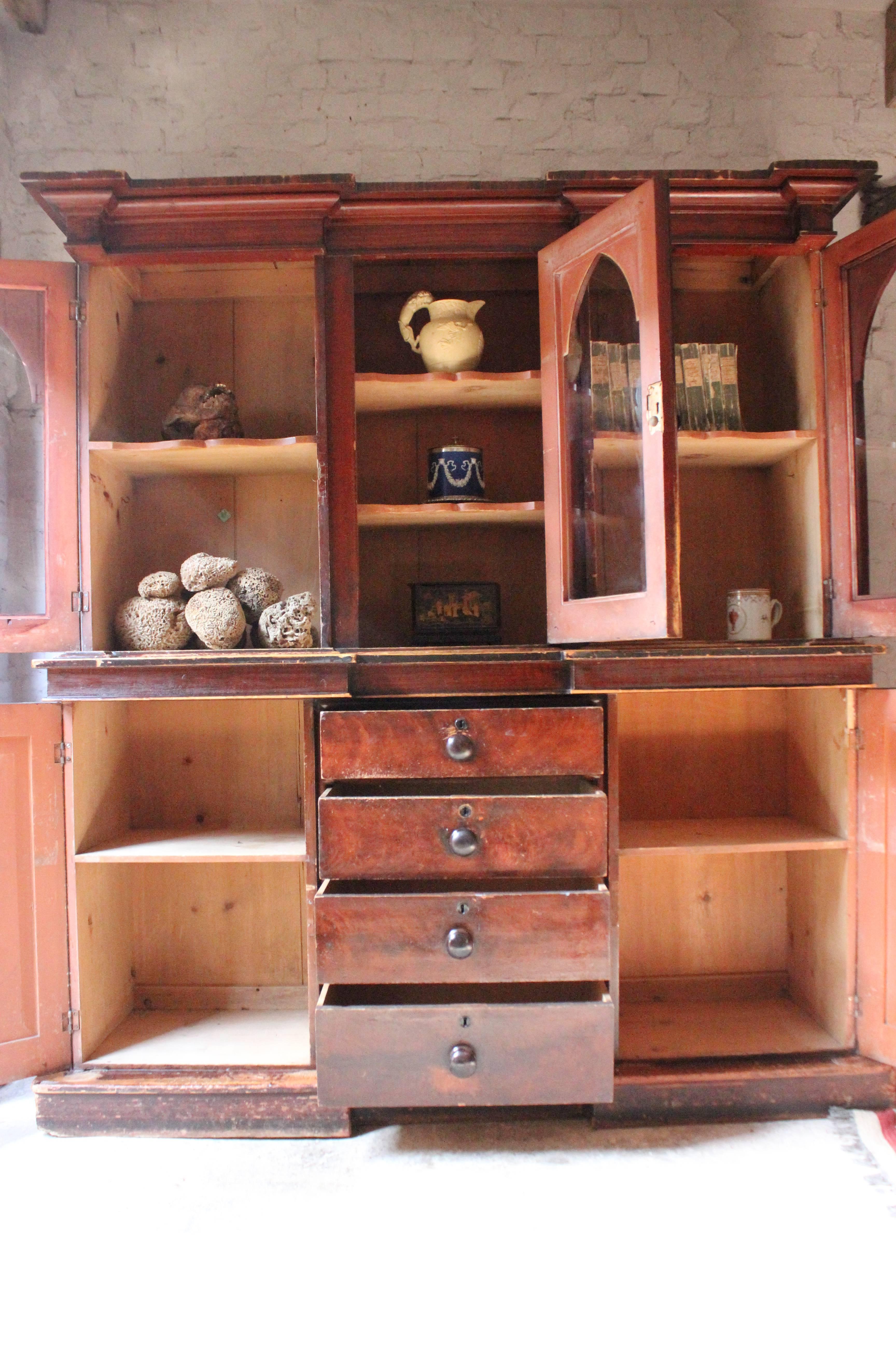 English Decorative, Gothic Revival Stained Pine Breakfront Bookcase, circa 1840 For Sale