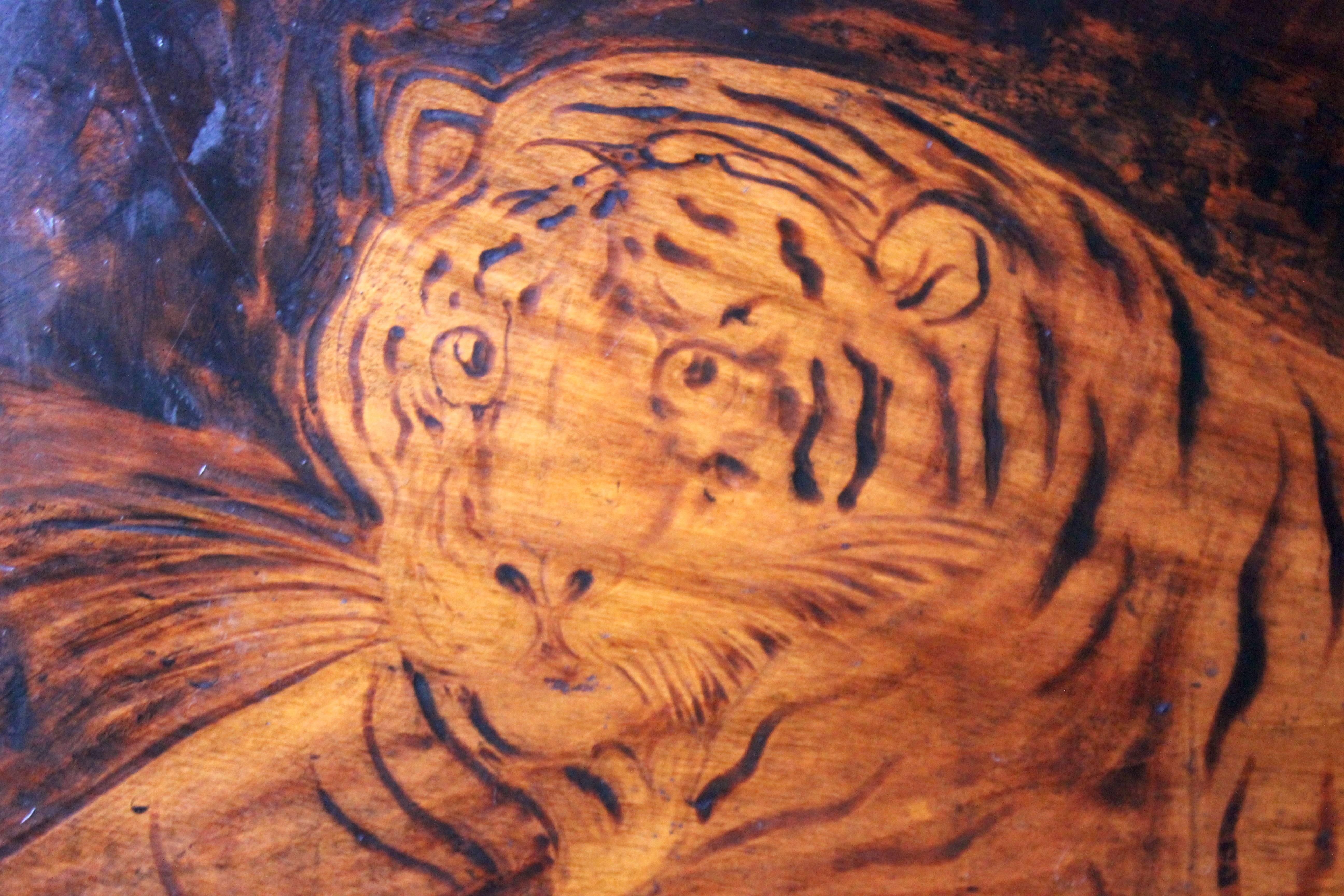 The finely-observed stained 'pokerwork' or pyrography panel by Joseph Smith of Skipton, north Yorkshire, depicting a tiger, after the oil by George Stubbs ‘The Portrait of the Royal Tiger’ circa 1770, the sycamore (?) panel signed and dated 1818,