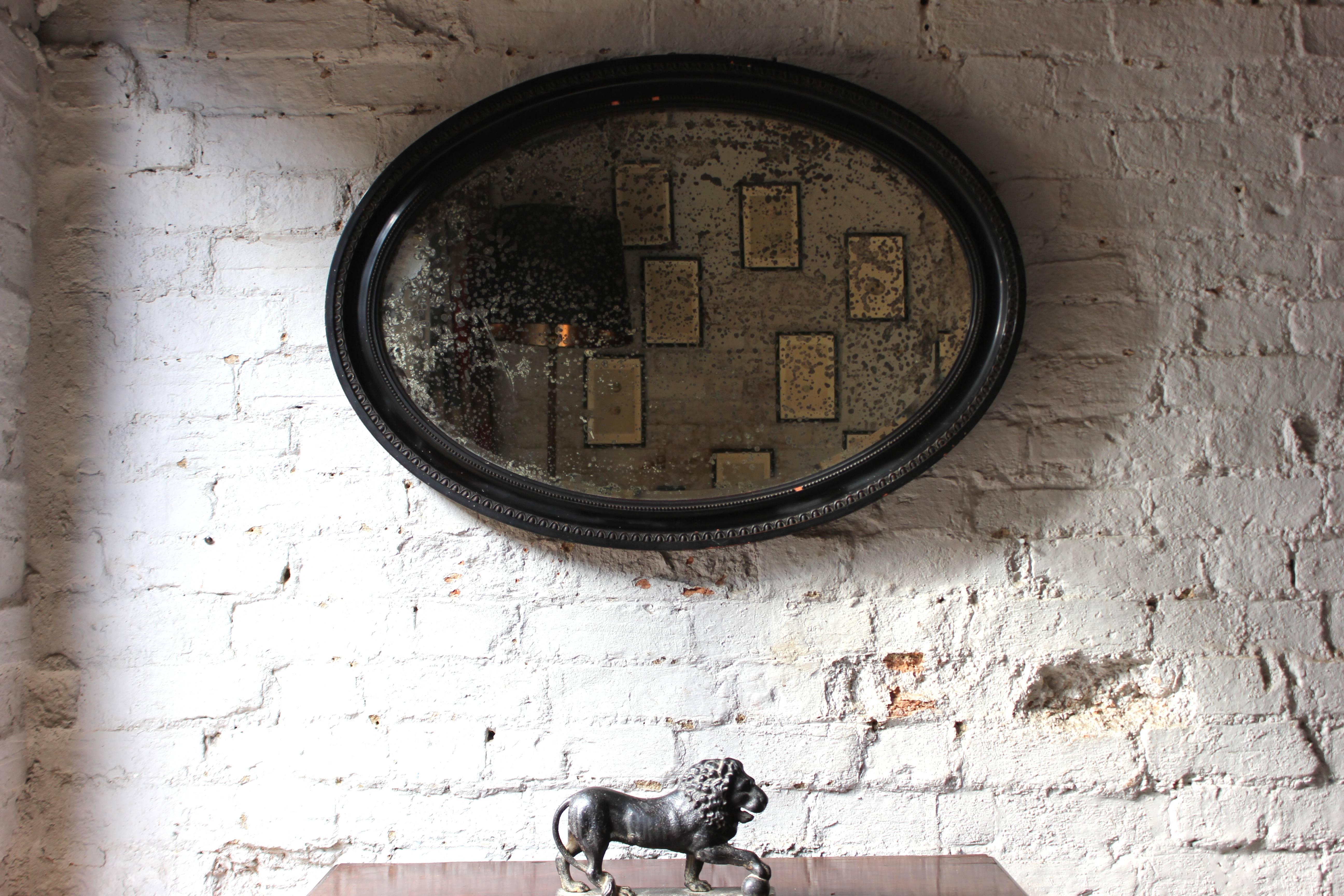 Late 19th Century Attractive Ebonised Victorian Oval Wall Mirror, circa 1870