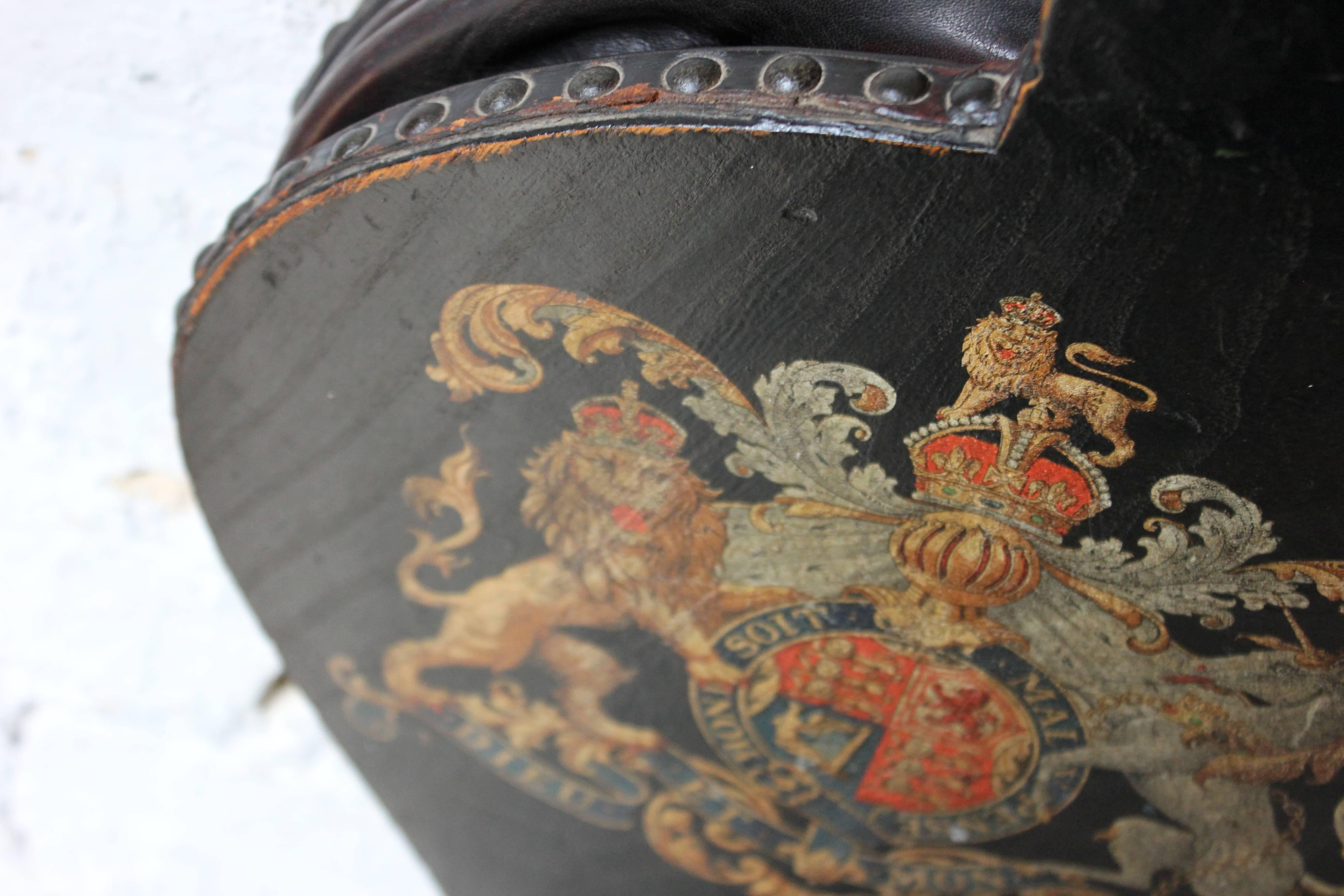 The Victorian period hand-painted and studded leather bound wooden pair of bellows of typical form with iron nozzle, the main body beautifully decorated with a polychrome Royal Coat of Arms Cypher on a black ground, now acting as a decorative piece