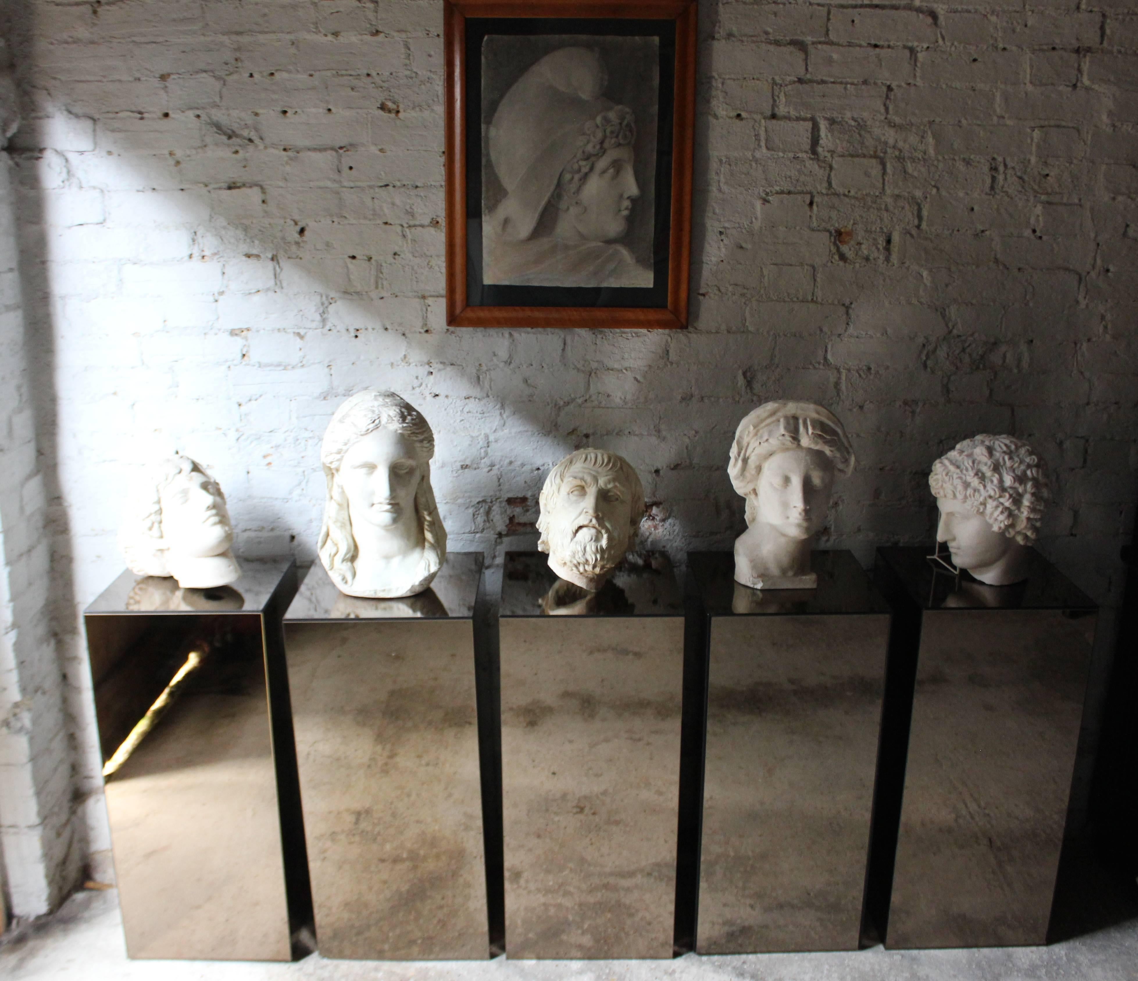 The highly decorative group of five well modeled studio portrait heads worked in composition plaster, after the antique, each depicting important figures from classical antiquity being two male and three female, and surviving from the second half of