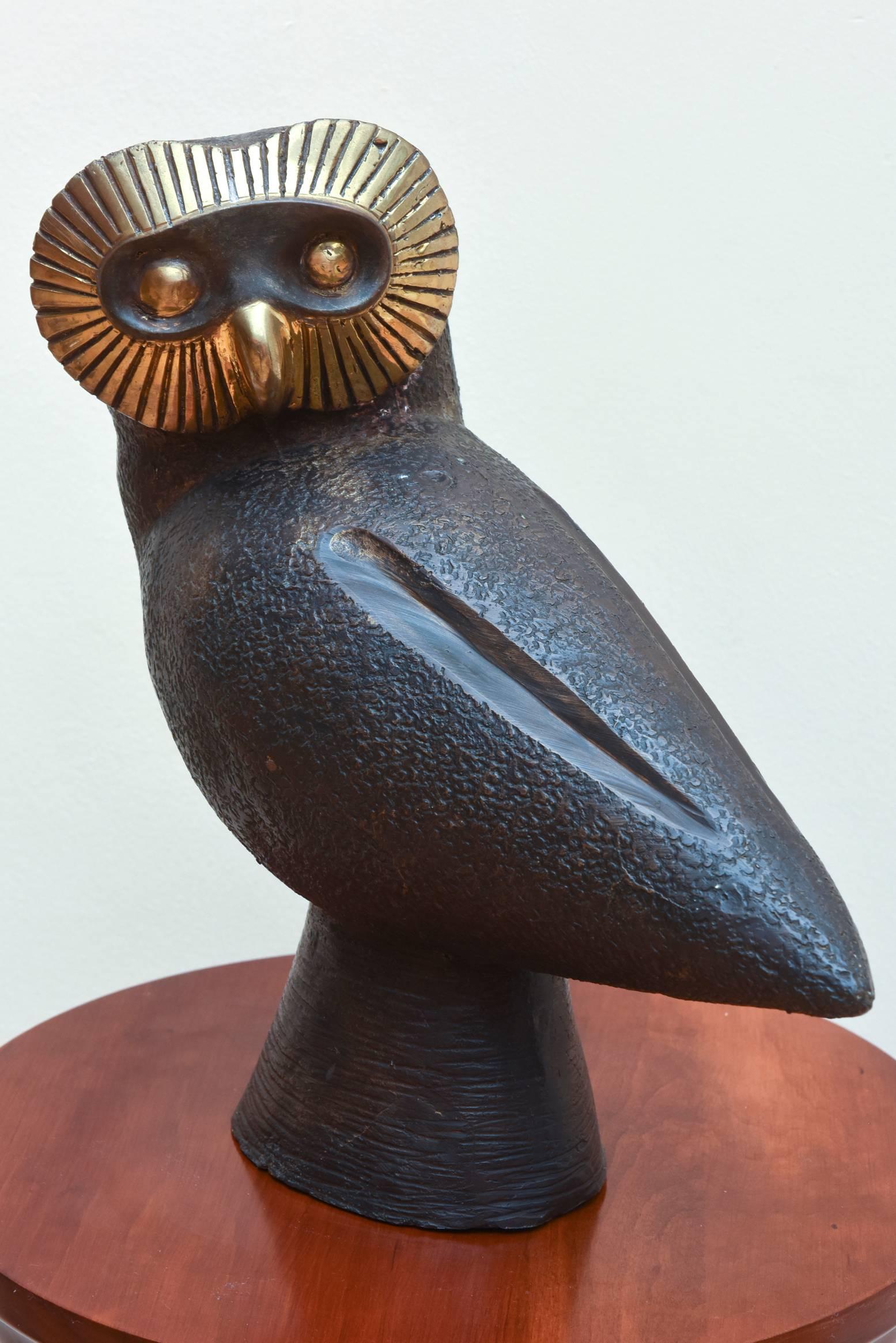 Impressive large Mid-Century Modern bronze owl with gold tone facial accents. Unsigned, great design.