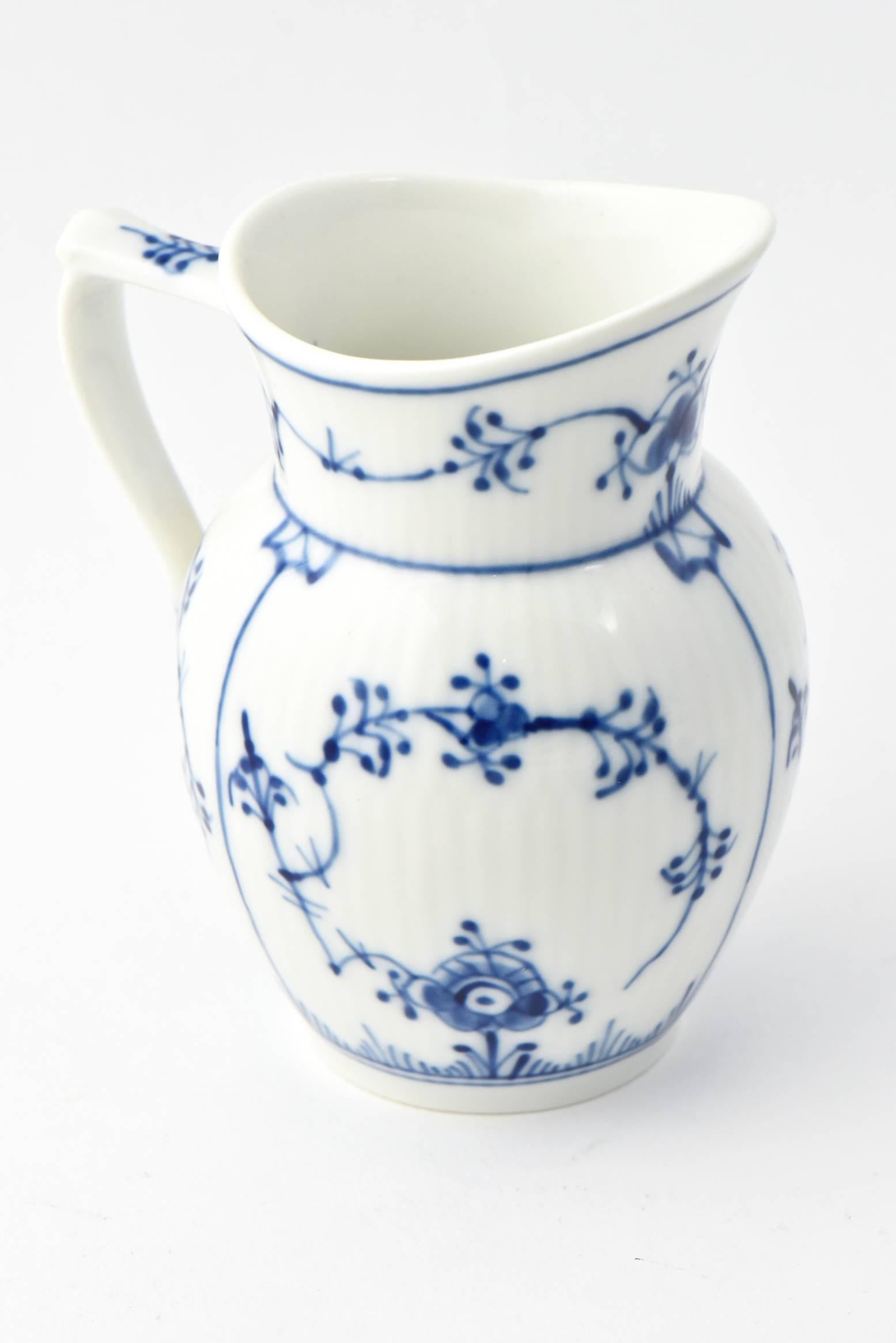 Royal Copenhagen three-piece porcelain set in the blue fluted pattern. The blue fluted pattern was introduced in 1775, the same year it was founded in Denmark, and has been in continuous production for more than 230 years. Measures: Sugar bowl, 3.5