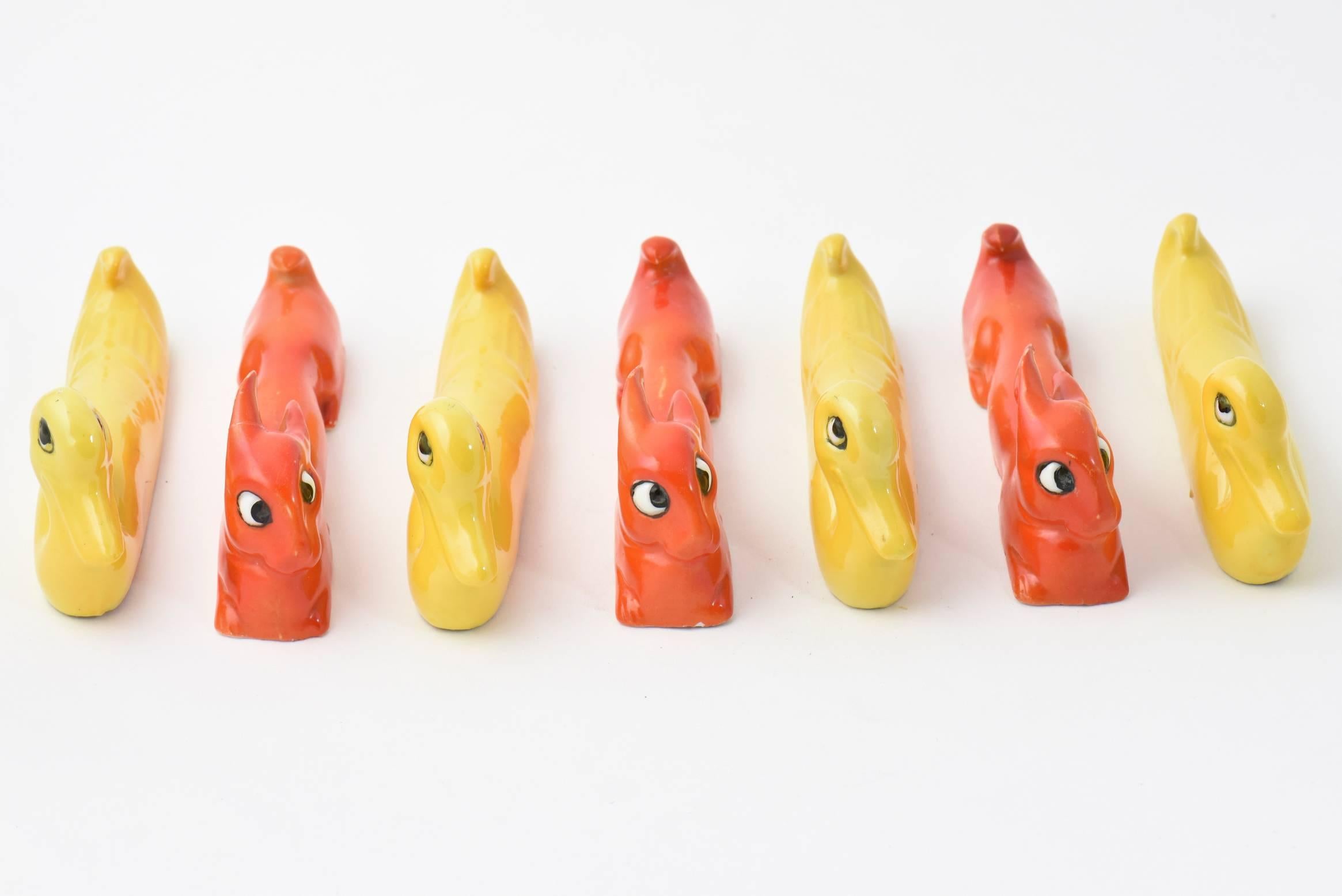 Art Deco ceramic hand-painted knife rests 
Stamped Germany and numbered
Four yellow ducks 
Three orange bunny rabbits.