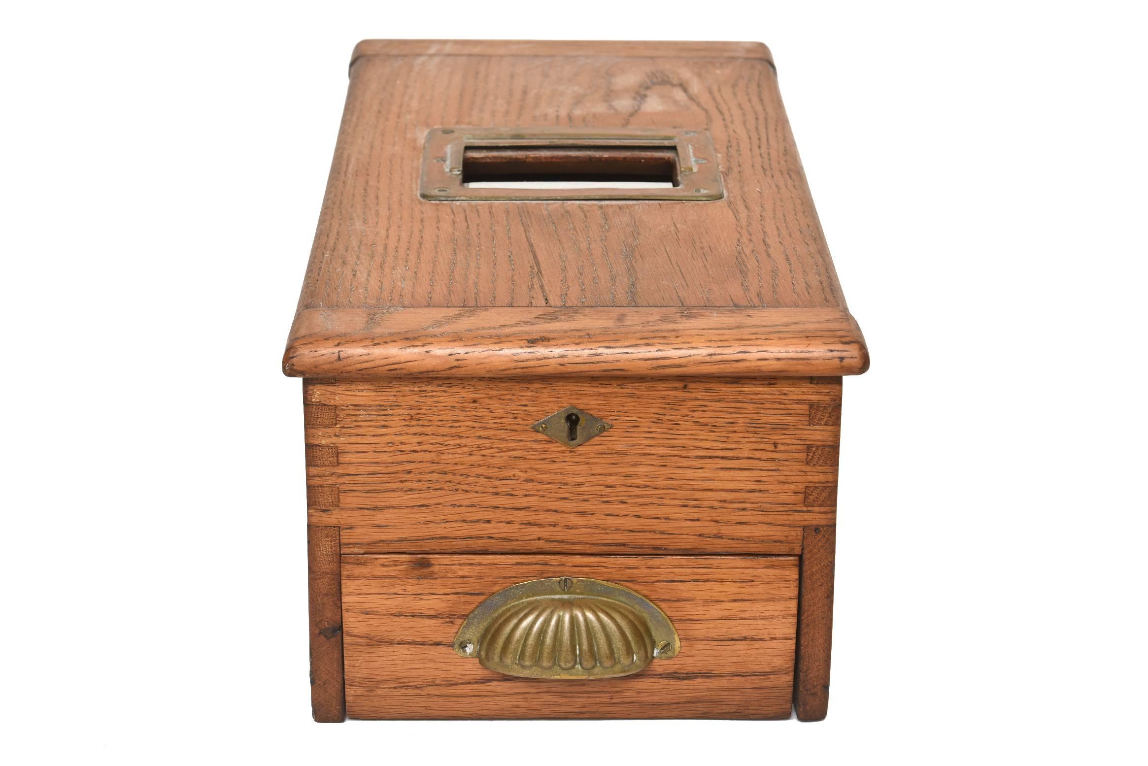 According to the client who had this box it was a Victorian ballot box.  Although with further research I believe it is probably a cash register till drawer.   

This Victorian box is an excellent example of a mid-19th century Wooden box with brass