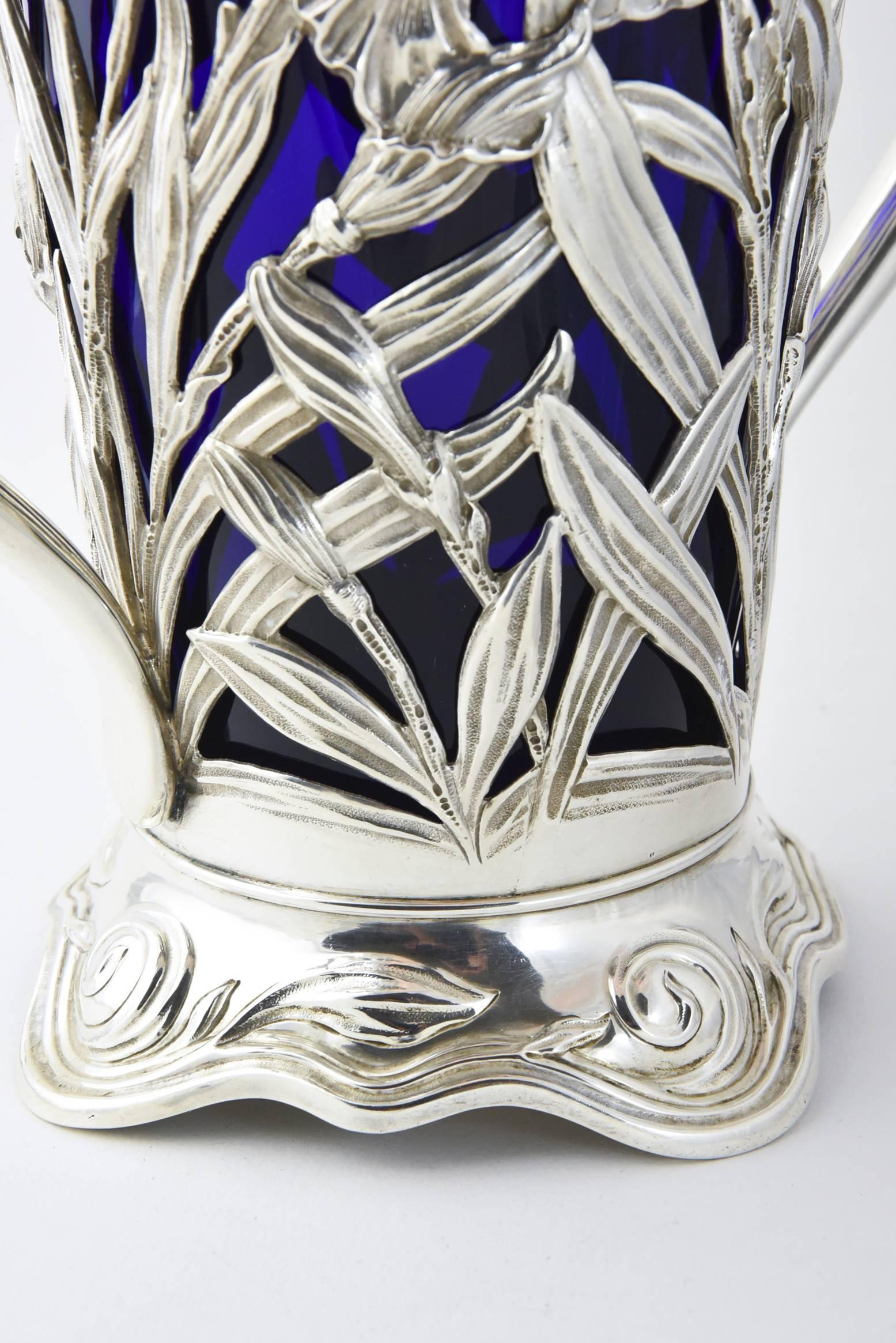 Unknown Art Nouveau Floral Repousse Sterling Handled Vase and Blue Glass Insert