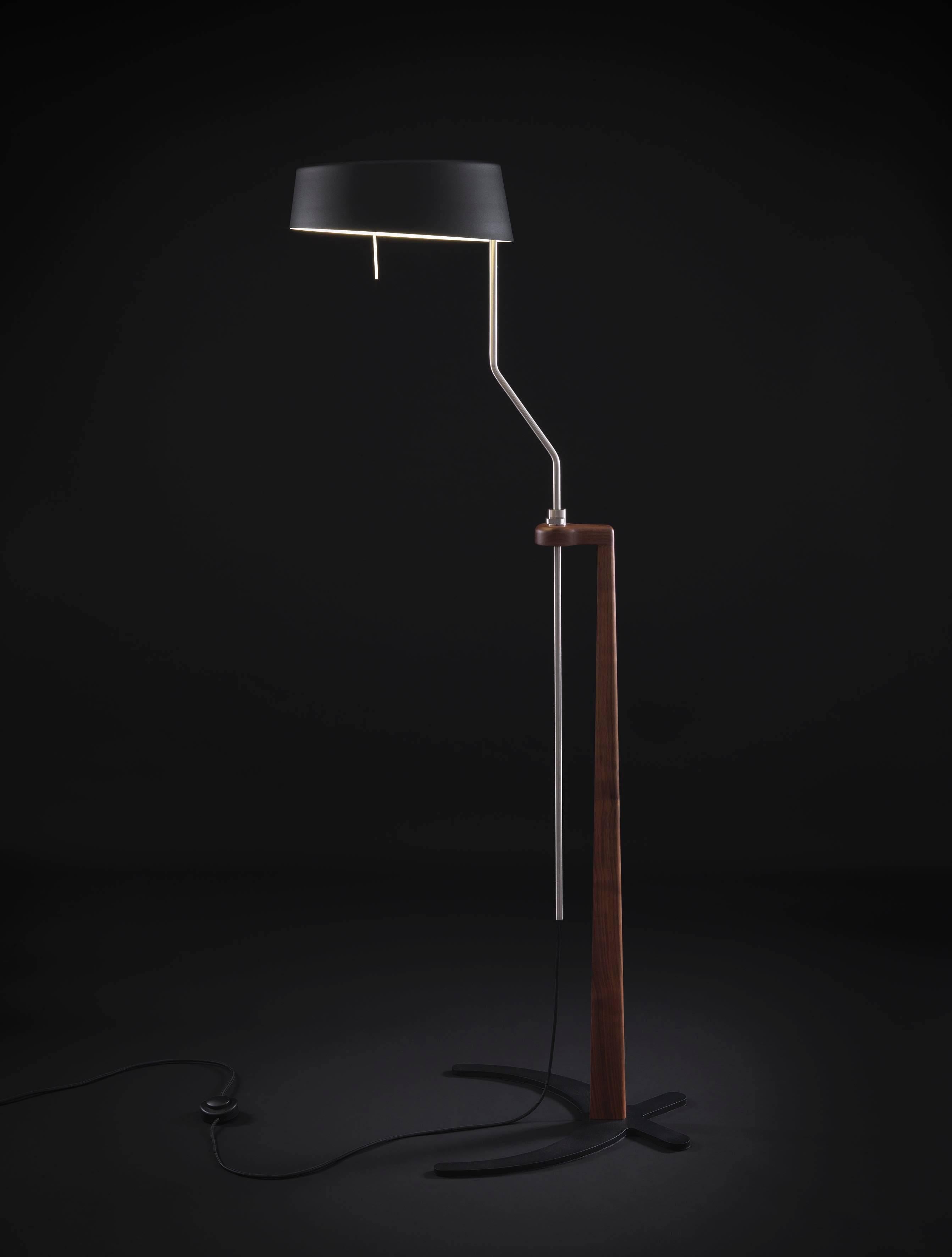 Her look is proud, no frills decorate her nice sharp face. Ottavia doesn’t feel the flowing of time, it’s durable as the essence of the wood she’s made of walnut. The natural quality of its fiber is perceptible. 

The lamp can be raised or lowered