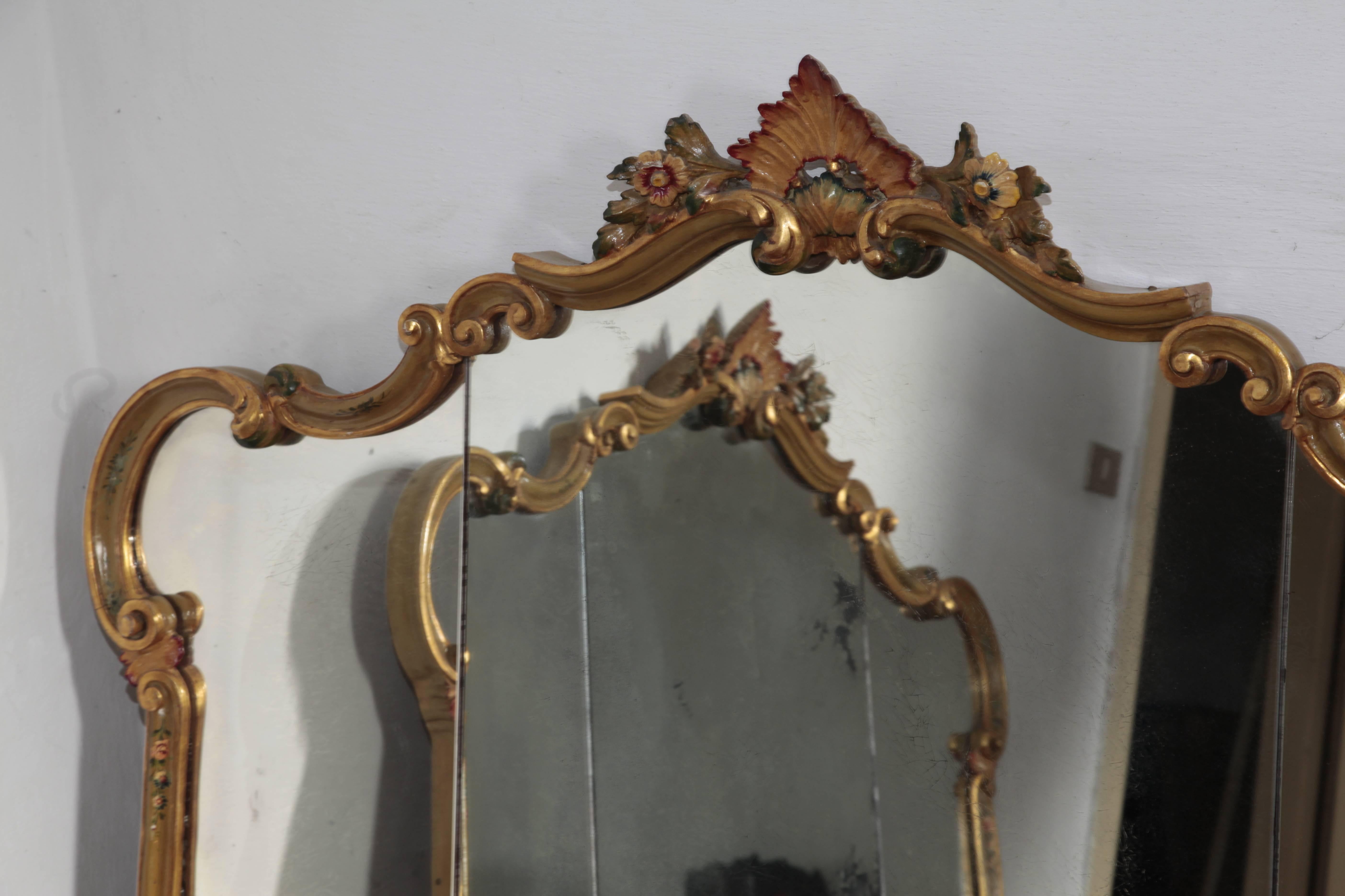 1920s original Venetian mirror, part of a larger collection consisting of a bed, armchairs, dining chairs, table, wardrobe, valet and vanity. These pieces have been sitting in an old villa in Veneto, and are on their original state. 

One mirror is