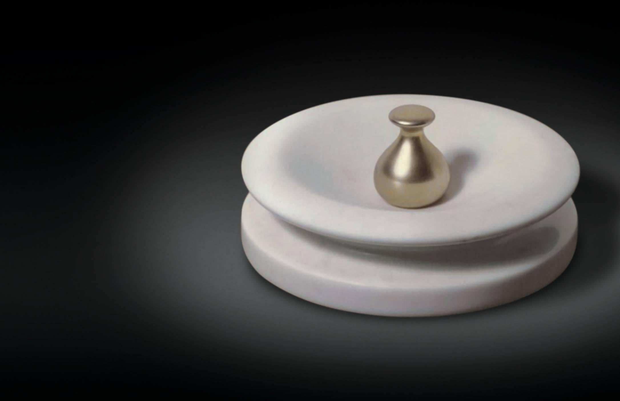 Carrara marble ashtray with solid brass pestle. 
Re-edition of this beautiful ashtray where the cigarette is turned off by a heavy brass pestle.