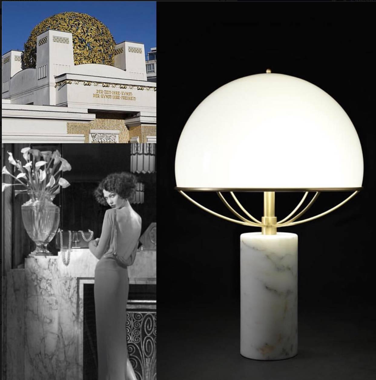 Italian hand-made table/night stand lamp with Carrara marble base, milky glass and brass. 

All pieces are made by artisans at the Lago Maggiore area, with local materials and decade-long industrial knowledge. 

The lamp gives a warm, diffused