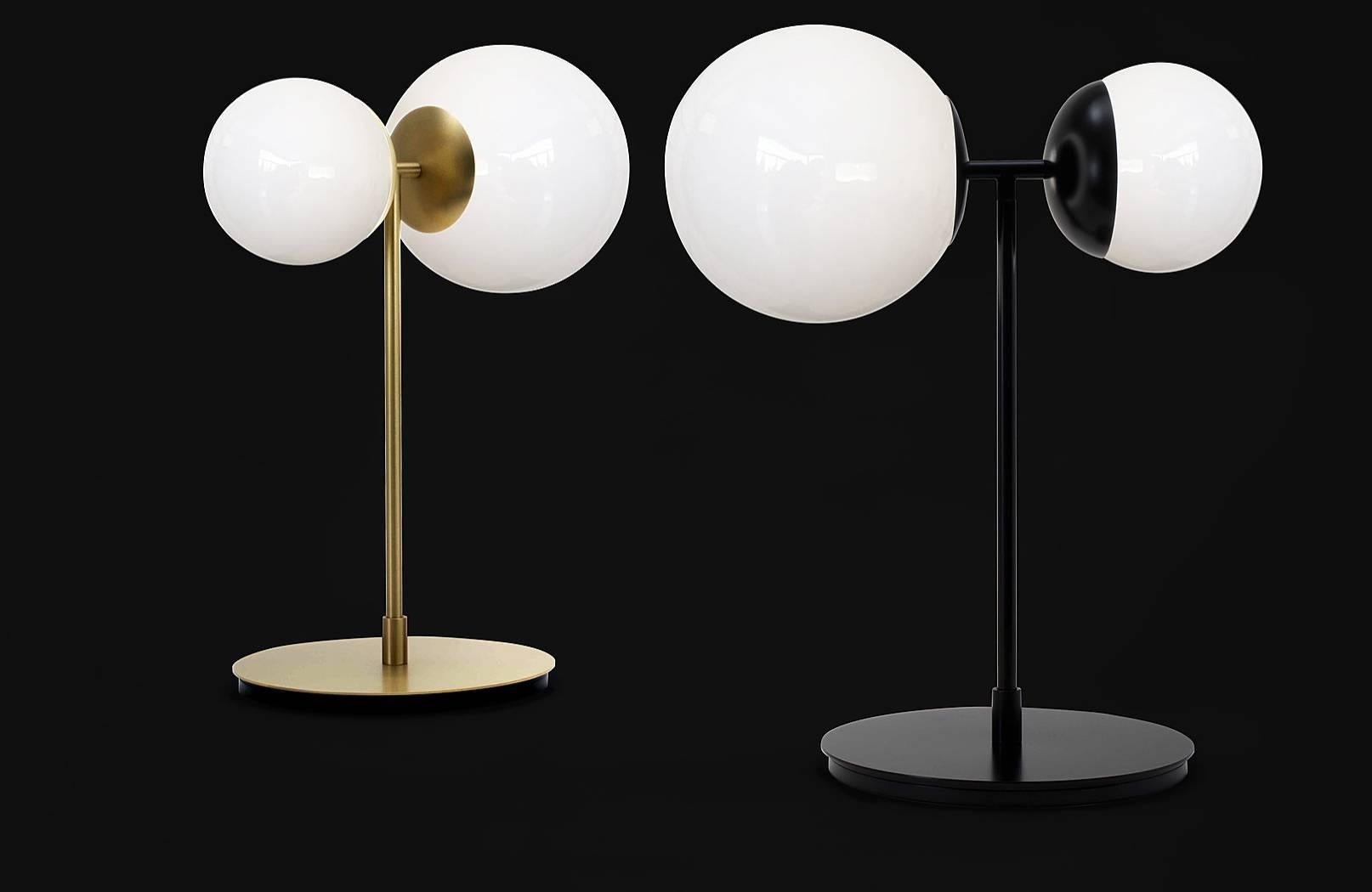 Beautiful table lamp with two spheres and brass or matte black body, produced by hand in Italy. 

Structure in brass, with a polished brass finish or black lacquered. 

1 x LED max 4W E14 and 1 x LED max 6W E27 
Light bulbs included
220/240 
Class