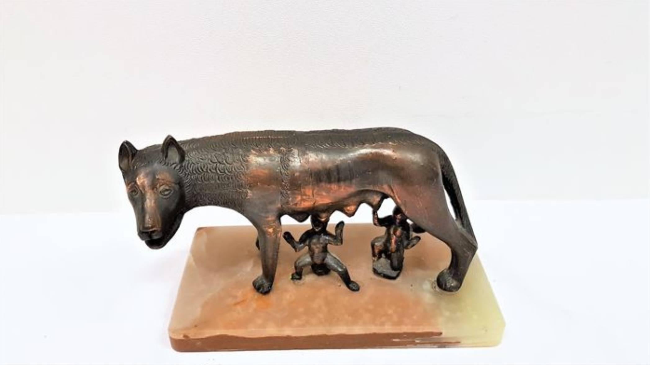 Beautiful replica sculpture of the she wolf mother with Romulus and Remus. 

The symbol of Rome a bronze she-wolf suckling Romulus and Remus, the legendary founders of the city is made of a copper alloy set on a marble base. 

The ‘Lupa