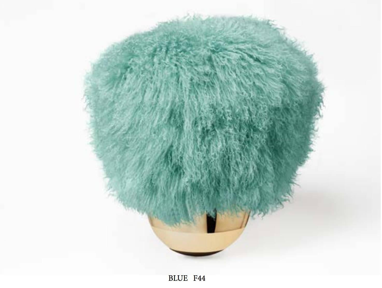 Swinging Pouf made of brass and Mongolian fur. 

Toad makes the research of equilibrium its fundamental point.
Toad swings, but it always returns vertical thanks to its counterweight in the half-spherical bronze base fused or sculpt in Saint