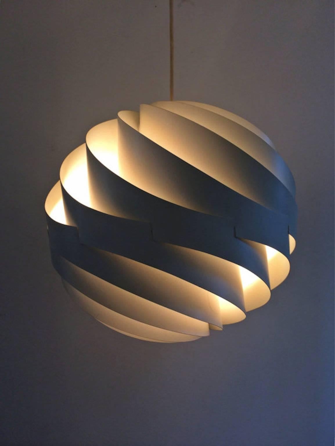 The Turbo pendant was designed in 1965 by Louis Weisdorf and put in production in 1967 by Lyfa. 

This amazing lamp illustrates design at its best: Simple in form, yet complex in structure and combines a sense of airiness and strength in a
