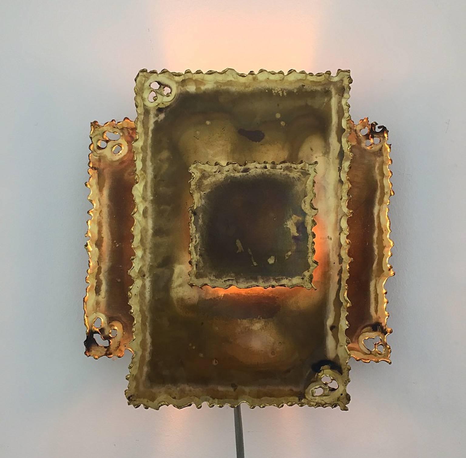 Flame cut wall sconce by Svend Aage Holm Sørensen of Denmark, 1960s.

Condition: Beautiful patinated with very few age related signs.

Light source: E14 Edison screw fitting max 50W. New wiring with 200cm new cord white plastic cord.

Size: (H x W x