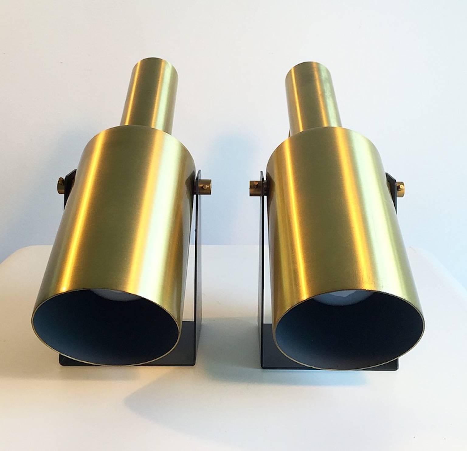 A very rare find: A pair of iconic brass wall sconces designed by Danish Hans Per Jeppesen in 1968 for the well-known manufacturer Fog & Mørup.

The lamps are very high-built quality with shades of brass and even the wall fixture and screws are