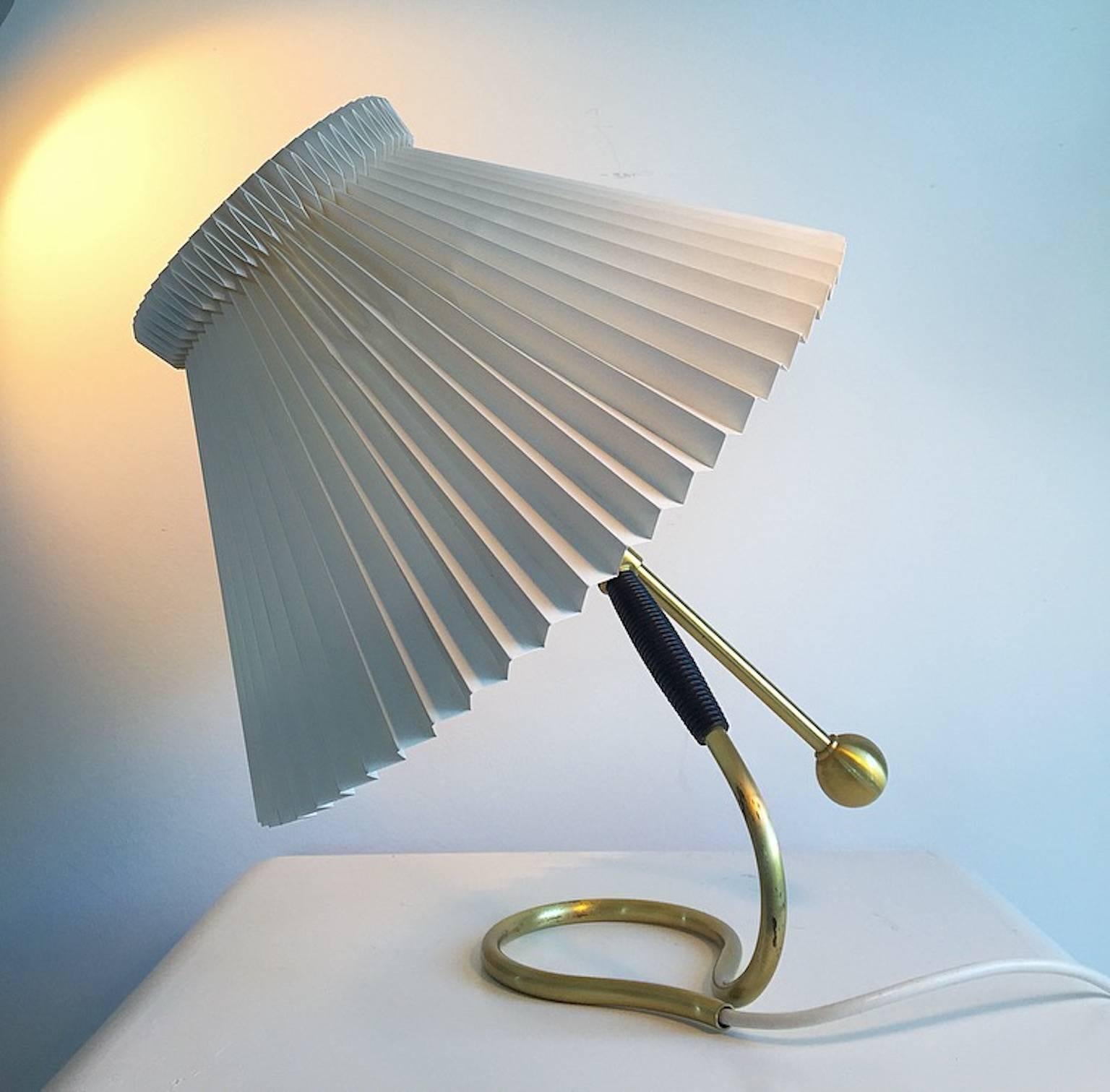 The grand father of Danish design Kaare Klint designed this beautiful brass lamp in 1945 and added a functionality to the lamp that hasn't been seen before at that time: The lamp could be tilted in different positions and even be used as a wall