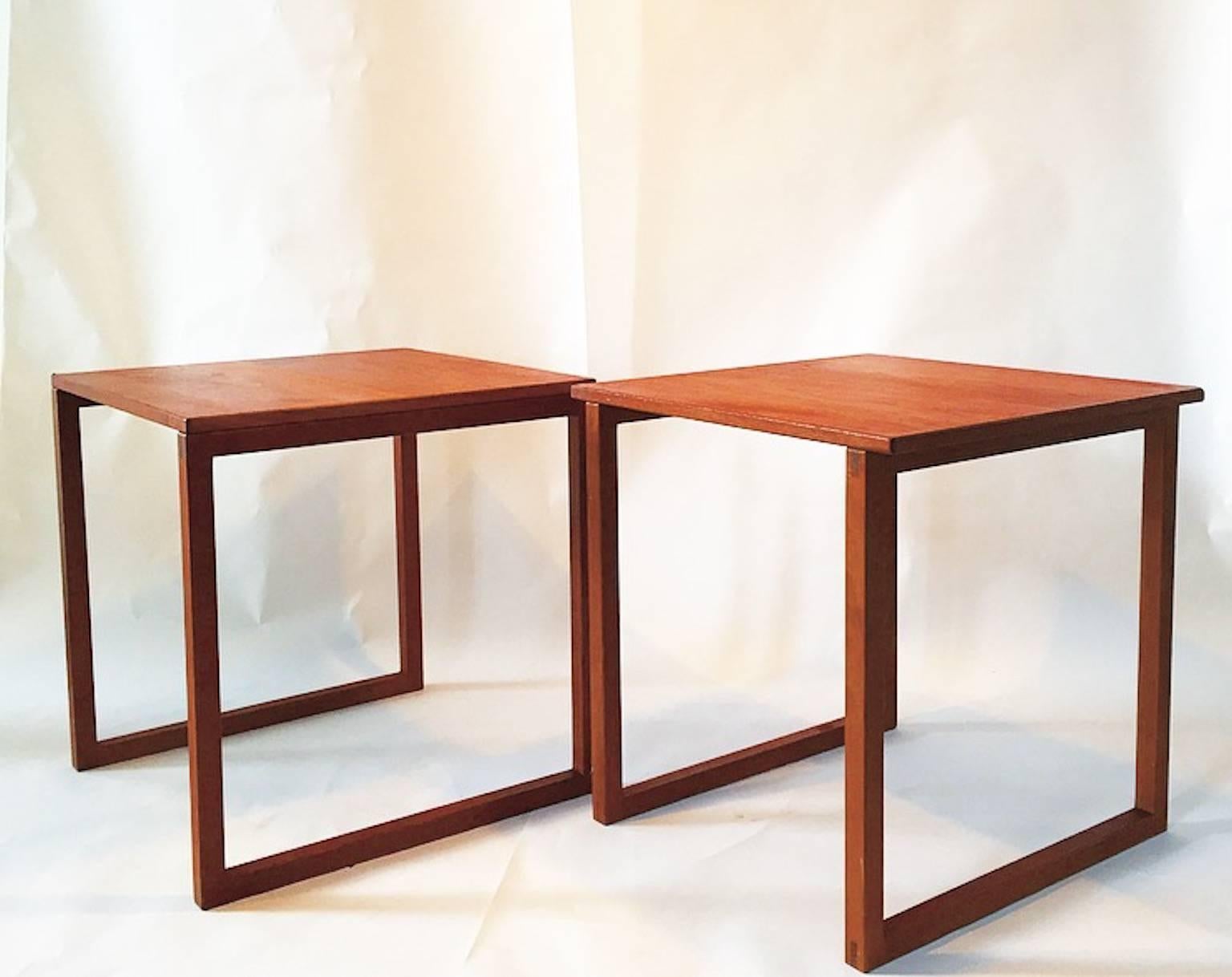 Functionality and craftsmanship are combined into this beautiful cube of teak nesting tables designed by Kai Kristiansen for VM - Vildbjerg Møbelfabrik in the 1960s. 

The two tables slide perfectly into each other and form a cube perfect for a