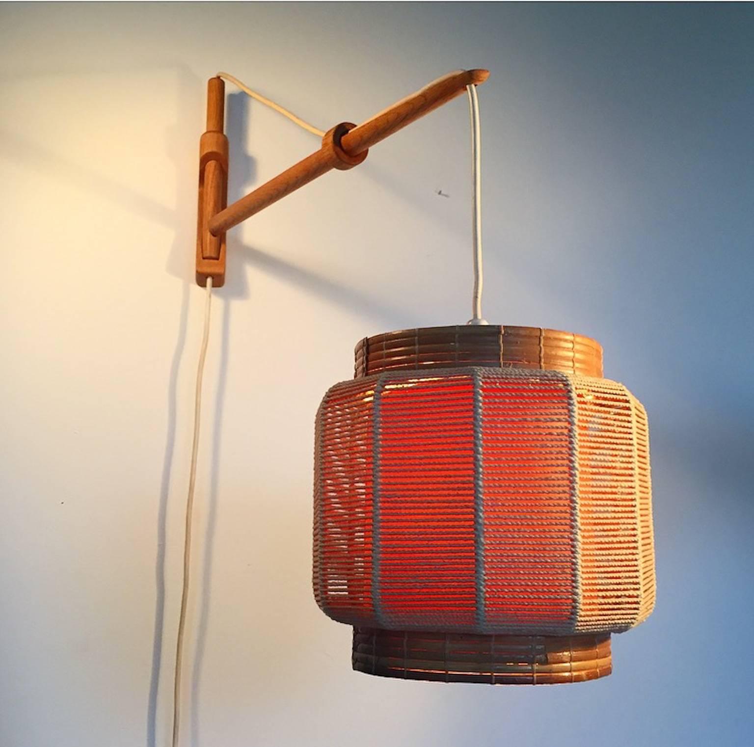 This extremely beautiful crafted wall lamp was designed by the world known Kaare Klint. Kaare Klint was inspired by Japanese lantern and craft, which this lamp beautifully combine.

This lamp that was only made in a limited edition because Kaare