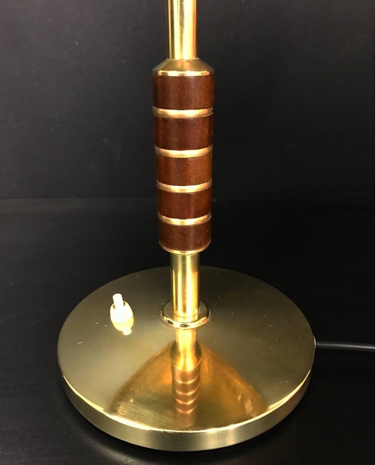 Beautiful and elegant brass table lamp from dansih LYFA 1956. Model number B146.

The stem is nicely decorated with five pieces of rosewood.

Solid brass with two-light sources.

Condition: All wiring has been restored and this particular