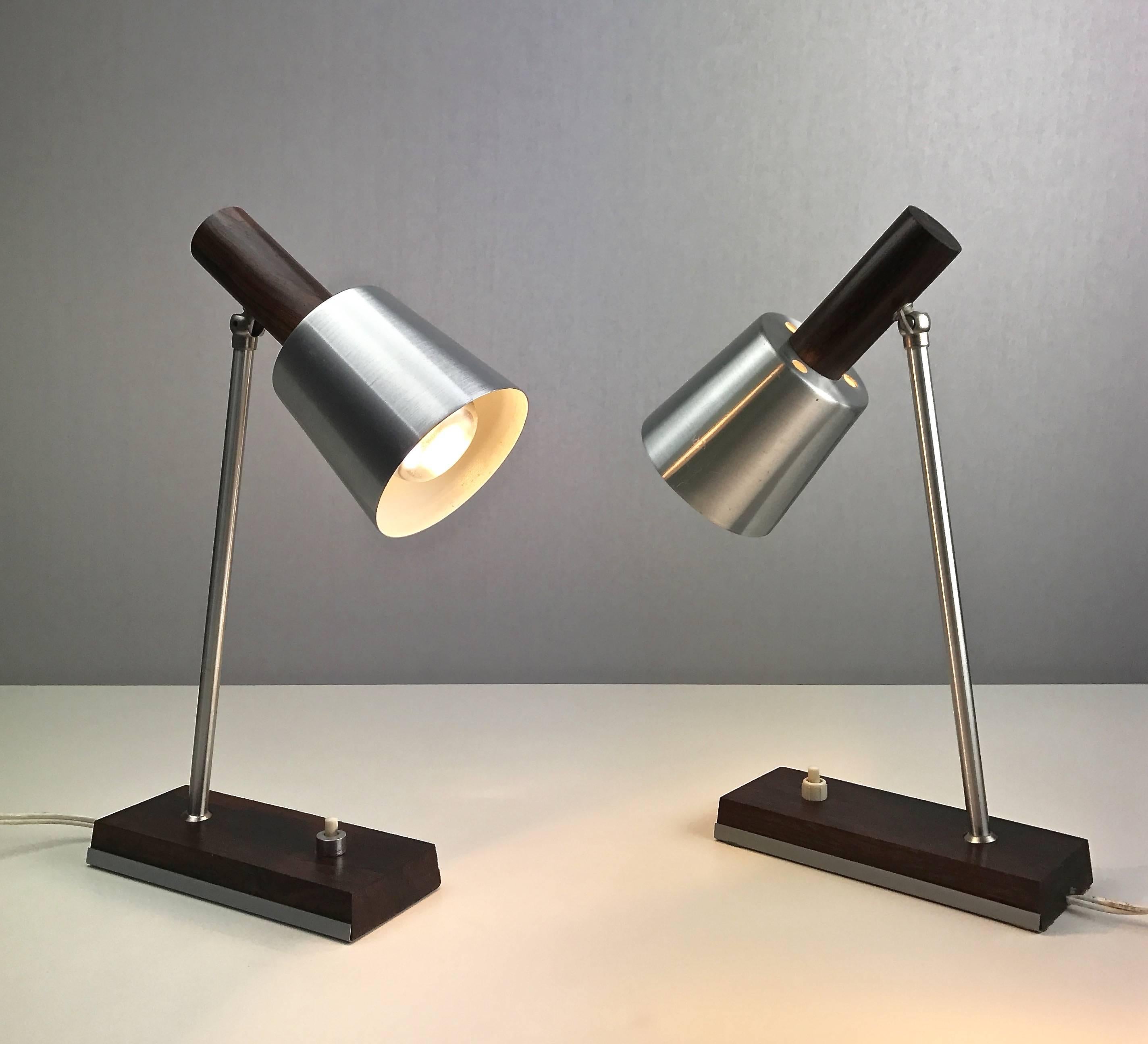 Amazing table lamps Silva from Lyfa, 1972.

The lights consists of brushed aluminium shade combined with genuine solid rosewood base and back part of the shade. 

Condition: Close to mint condition.

Light source: E14 / E12 edison screw