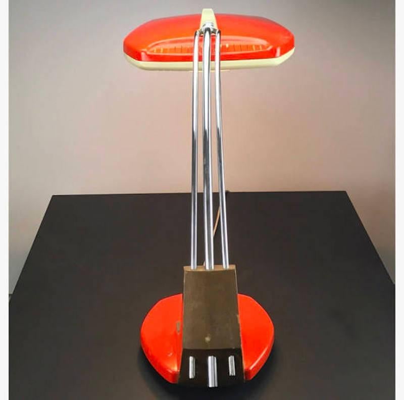 Spainish made elegant table or desk lamp by Fase of Madrid in 1960s. 

The model is called Falux and has the rare orange lacquer combined with creme / off white lacquer, walnut base and opaline glass cover. 

The majestic Falux table lamp has a