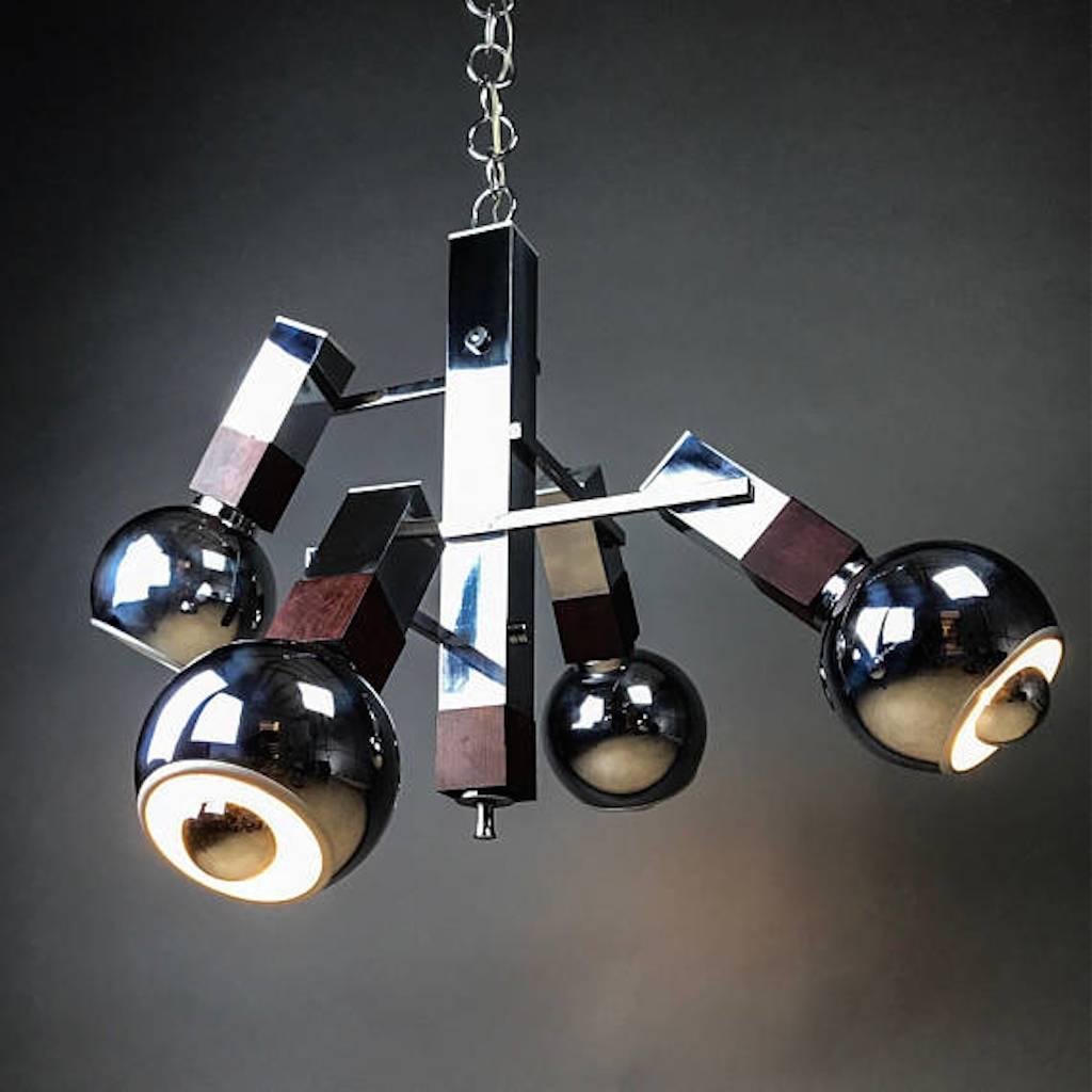 This is indeed a collectible design piece for your home: An elegant and impressive Mid-Century modern chandelier designed by Targetti, Italy, late 1960s, but what is so special about this light is that it has been tugged away for four decades at a