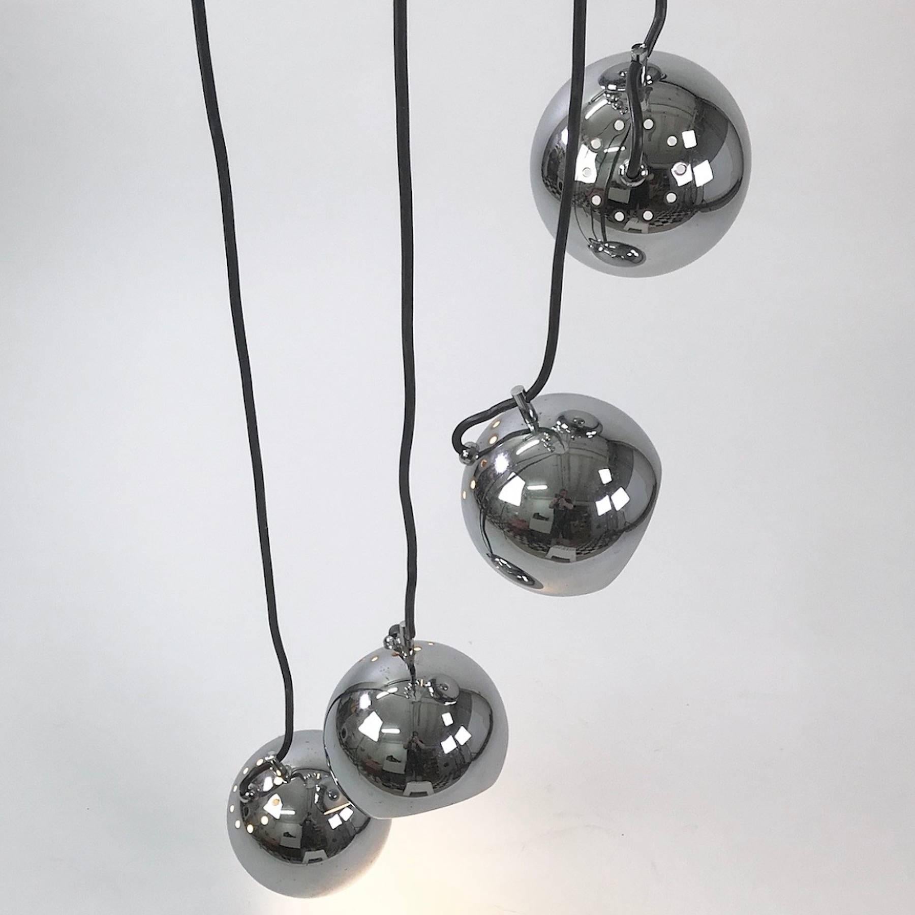 Sometimes our hearts skip a beat when we are treasure hunting. Like in this case where we accidently stumbled over this Mid-Century Modern cluster chandelier. 

This Italian designed Harvey Guzzini chrome chandelier was produced by Meblo in the