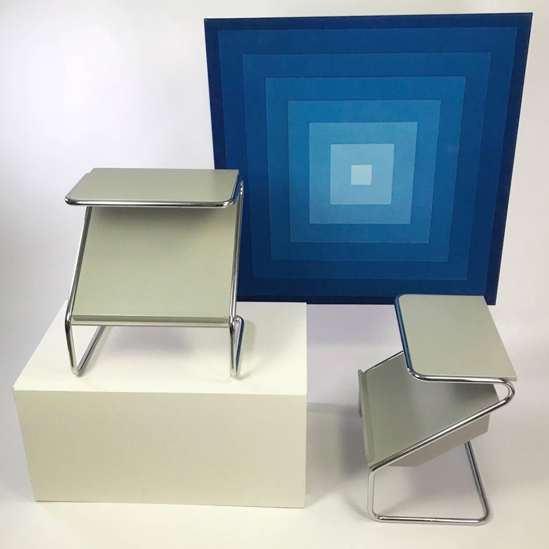 In need of a functional bedside table with hidden storage: This beautiful and rare set of grey lacquered nightstands will be perfect for your bedroom. Or maybe as side table in your living room.

This Classic set of Bauhaus styled furniture is