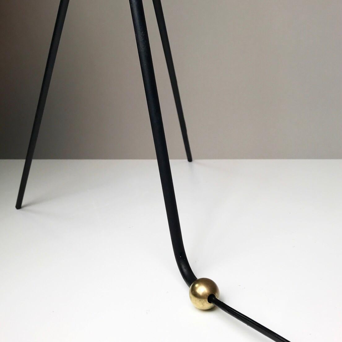 Finding a beautiful 1950s floor lamp with details like on this light is extremely rare.

Look at the tripod base how it twists graceful around the stem and how the back leg ends with a solid round brass knob, it’s indeed a stunning piece. 

Good