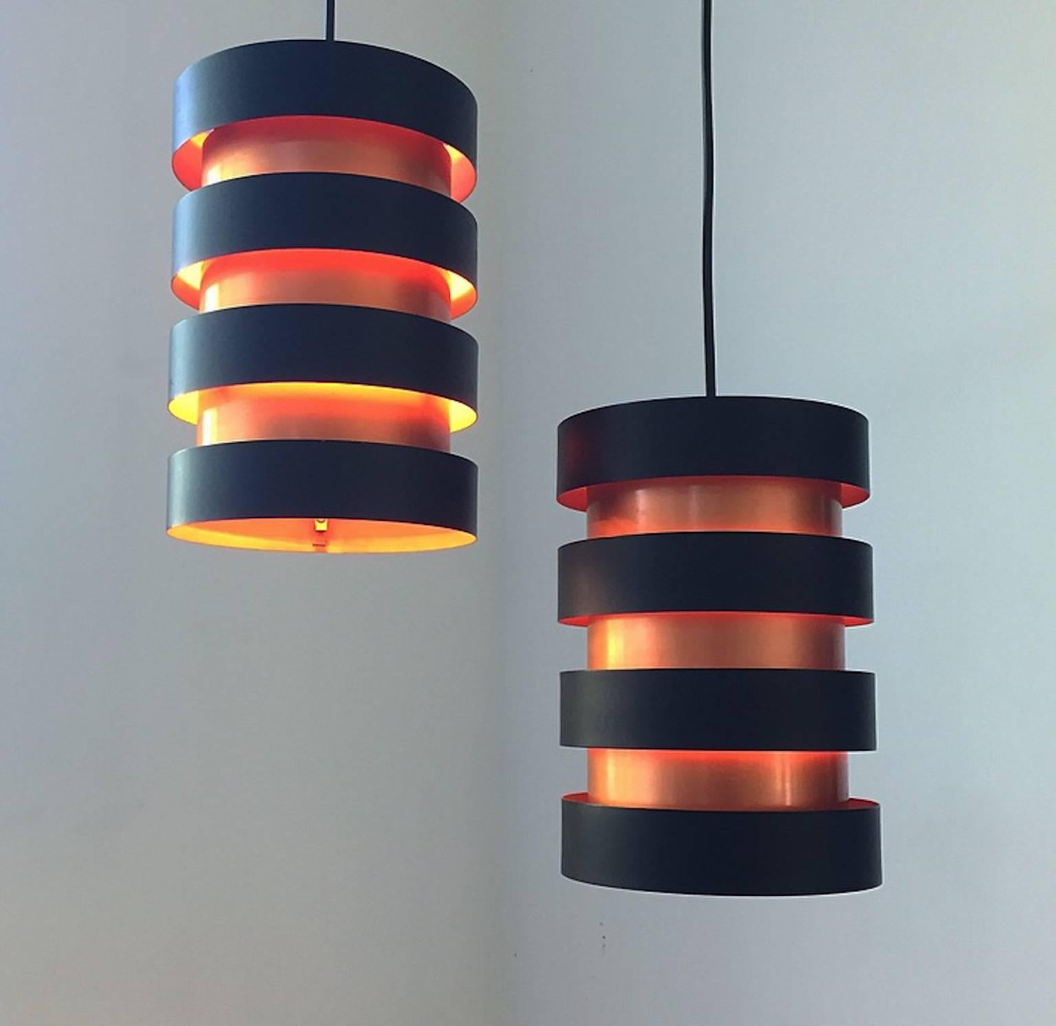 Beautful Danish Eifel pendant by Jo Hammerborg for Fog & Morup of Denmark, 1963.

Extremely well built ceiling light as for all of Fog & Morups creations.

The light consists of seven rings, four copper lacquered inner rings and three outer