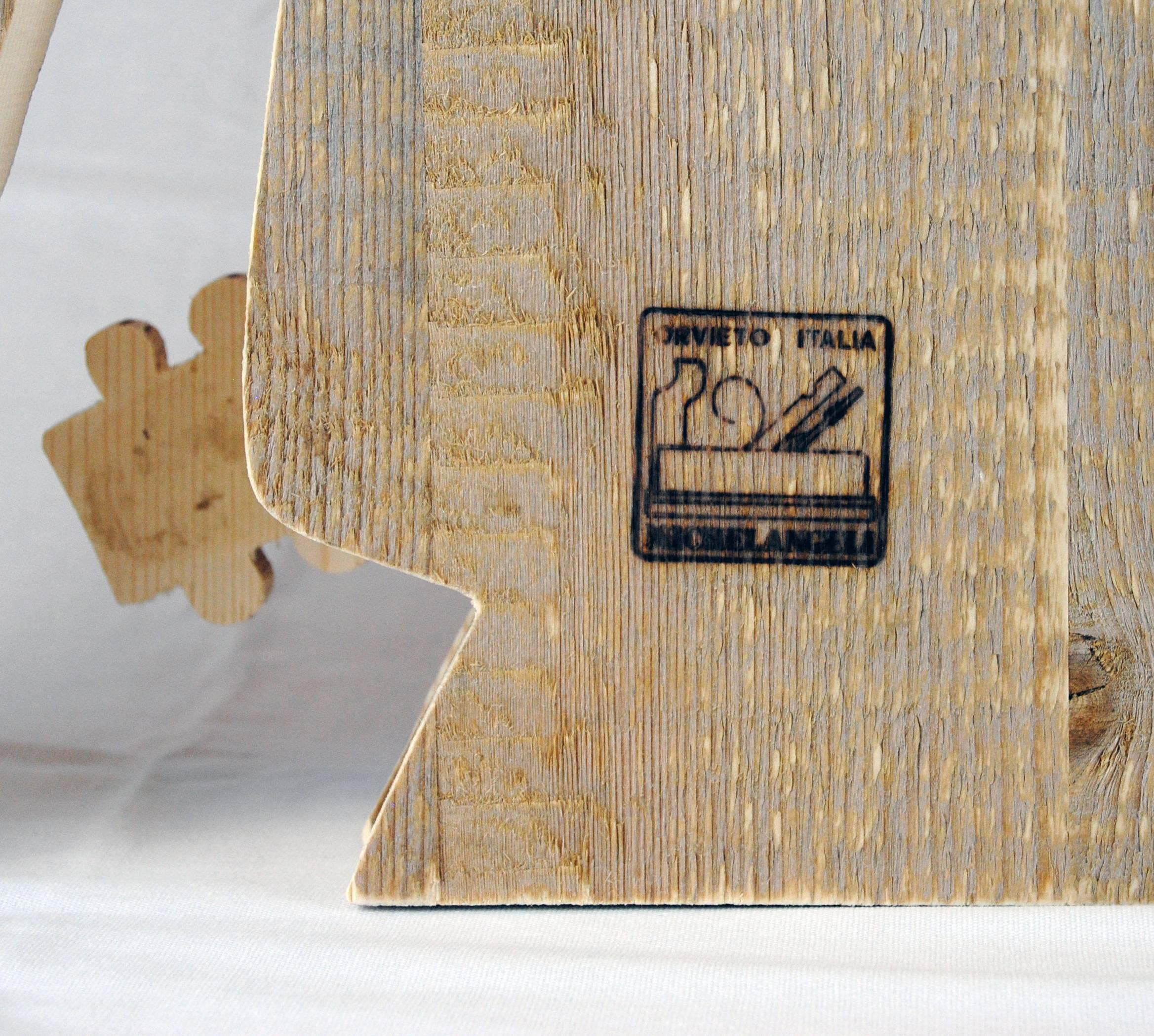 Enchanting sculpture by Michelangeli. This sculpture takes inspiration from the fresco, made by Signorelli, situated in the Cappella Nova in the Duomo cathedral of Orvieto. Made in seasoned solid fir wood. This ageing technique of the fir,
