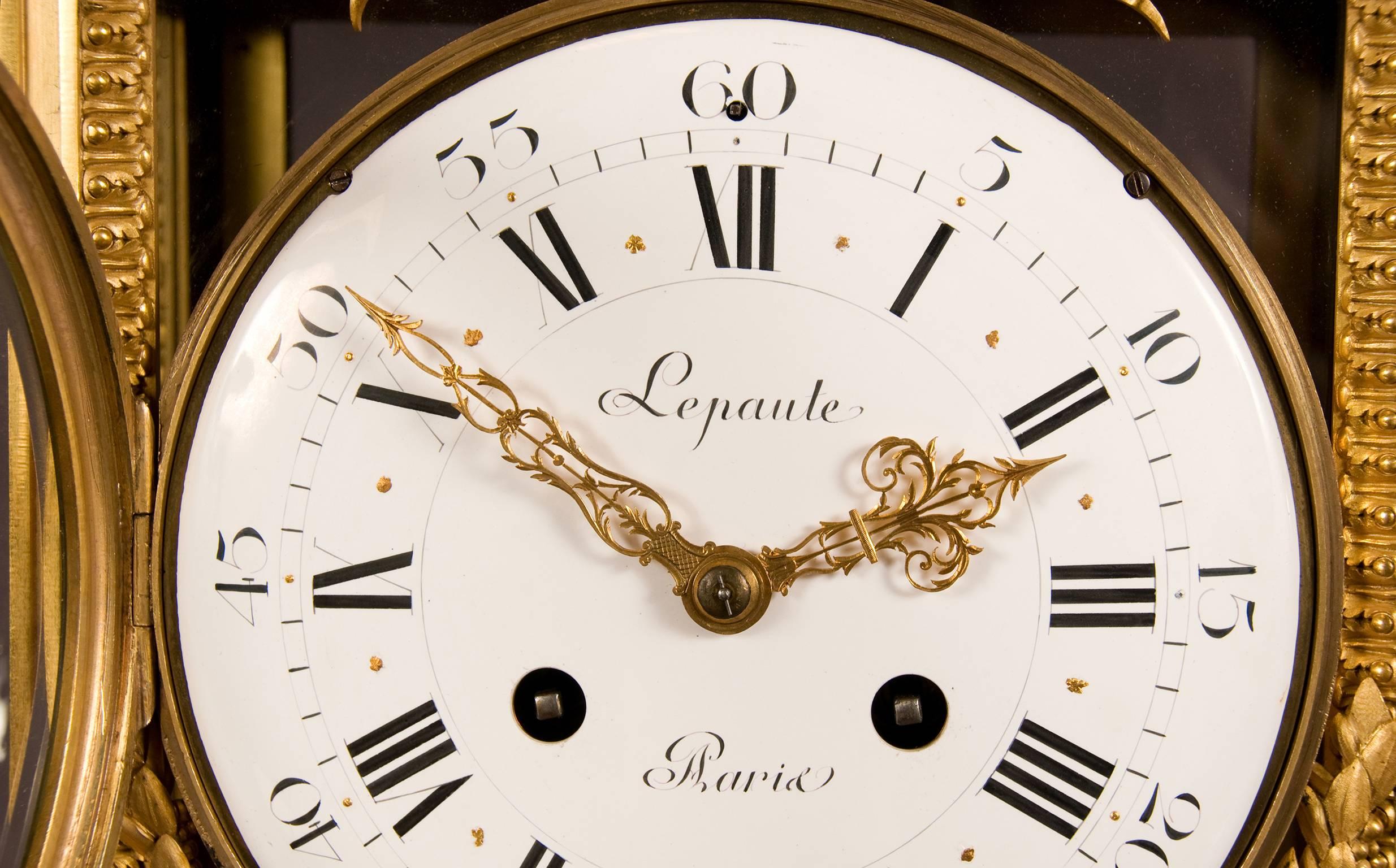A very nice Louis XVI style mantel clock in a glass cage, 16.5 cm enamel flower garland dial, with gilt half hour marks, Roman numerals for the hours, Arabic minute indications and gilt hands. Signed on the dial Lepaute a Paris. Mounted in a gilt