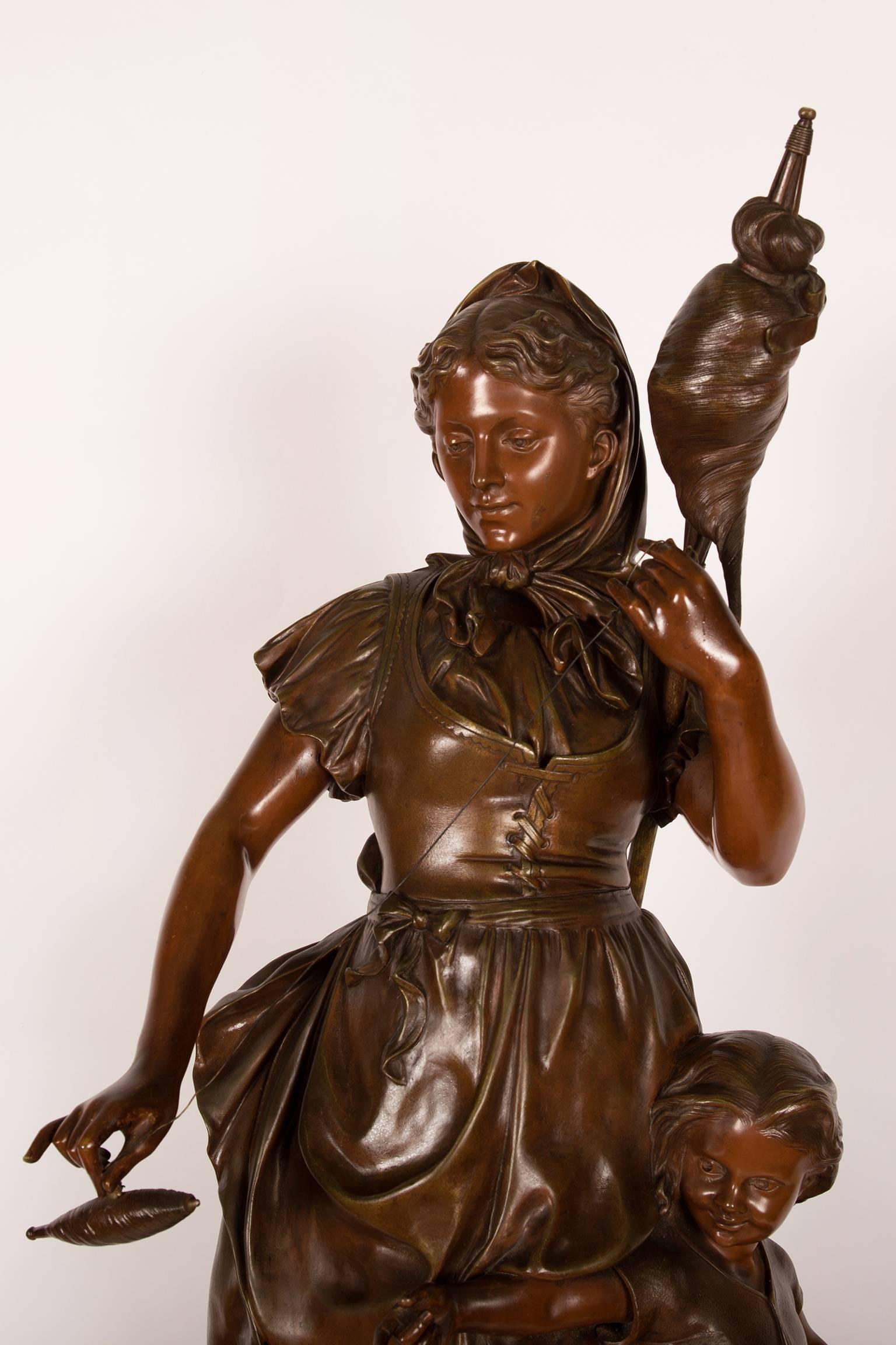 Large patinated bronze sculpture of a mother and child, the mother holding a distaff and a spindle. It is a French Romantic period genre scene symbolising rural domestic life and Motherhood. The sculpture is in very good condition and has a