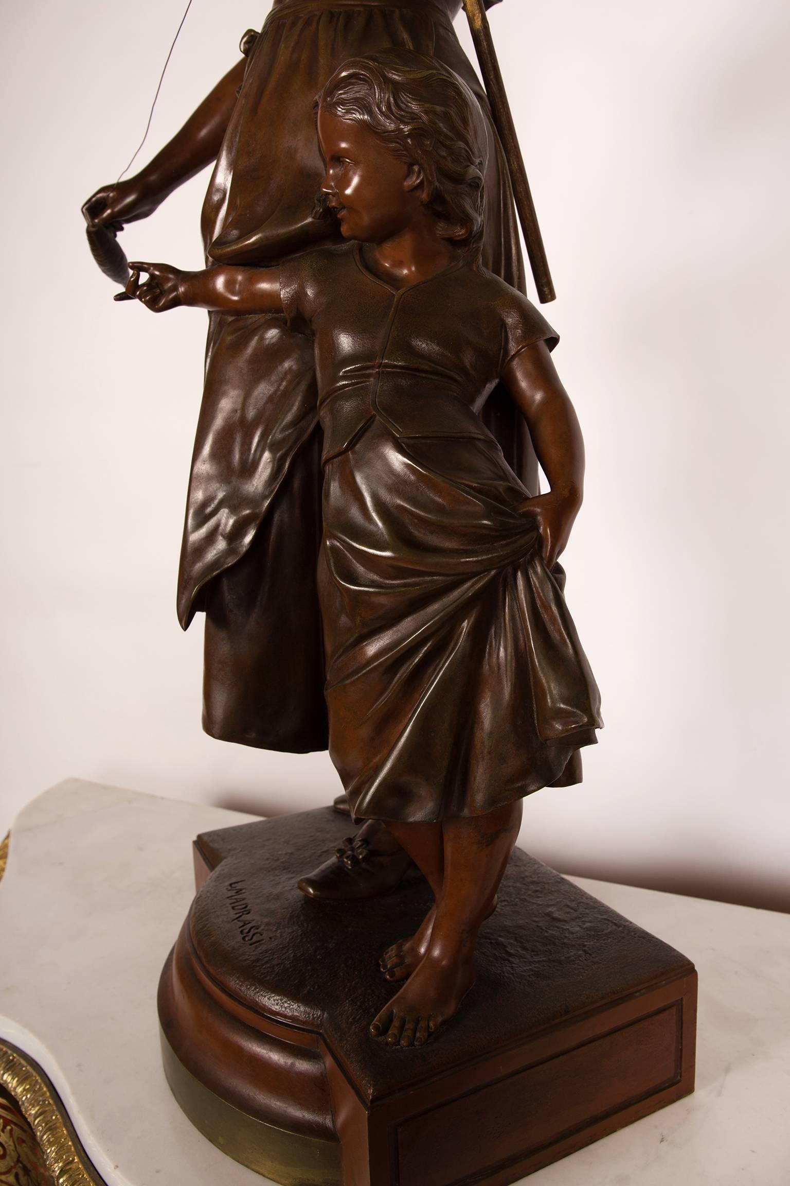 Patinated Sculpture in Bronze Signed L. Madrassi a Child and His Mother Holding a Distaff For Sale