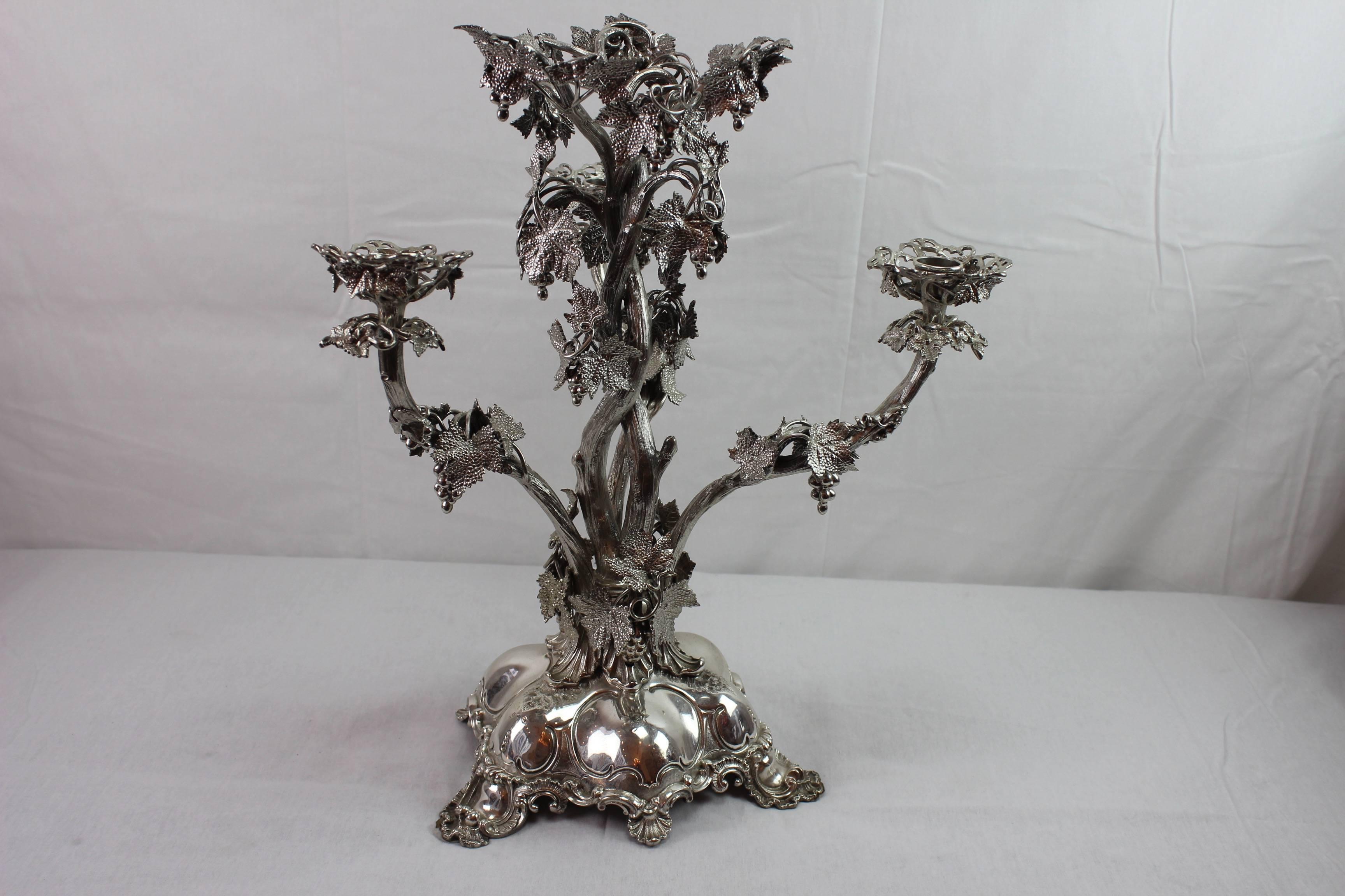 Stunningly manufactured Austrian centerpiece. Abundantly ornamented with detailed grapes and grape leaves. The original crystal bowl which is usually placed on the top is unfortunately missing.
Has a 19th century Swedish silver hallmark.