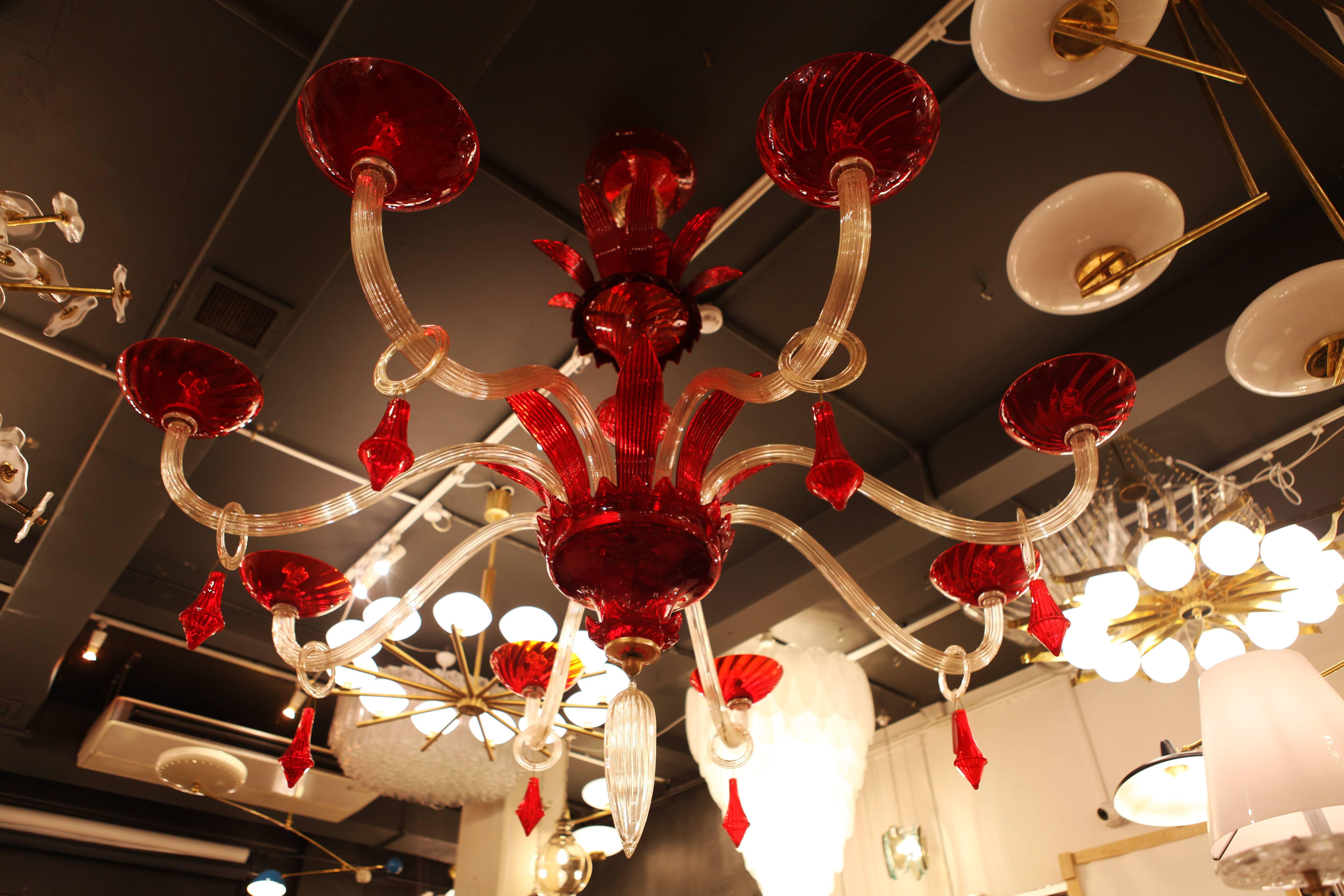 An Italian designed extra large Murano chandelier in handblown red and clear glass of monumental proportions created by Gino Cenedese, 1950.